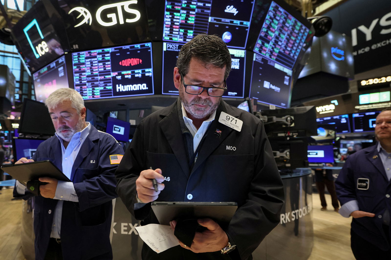 FILE PHOTO: Traders work on the floor of the New York Stock Exchange (NYSE) in New York City, U.S., April 14, 2023. REUTERS/Brendan McDermid