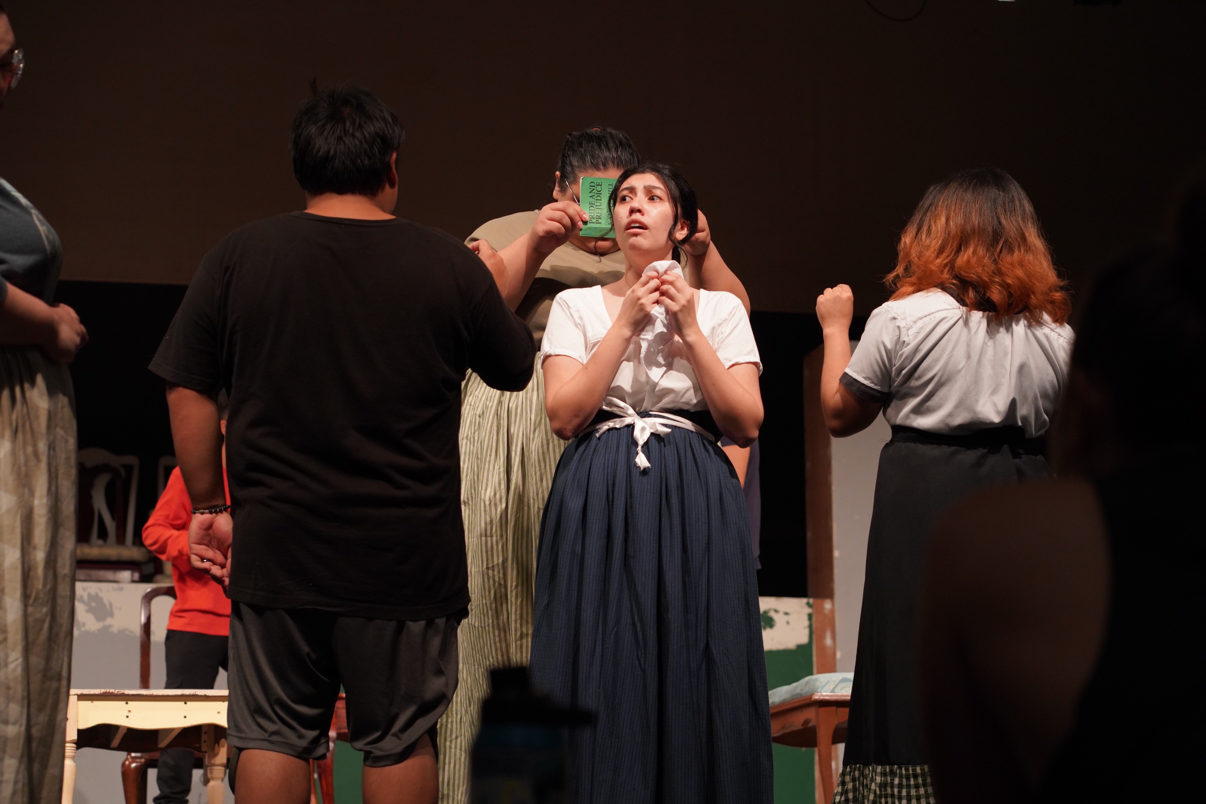 Hannah Elmore gets into her role as Jane Bennet on April 4, 2023, at the University of Guam Fine Arts Theatre.