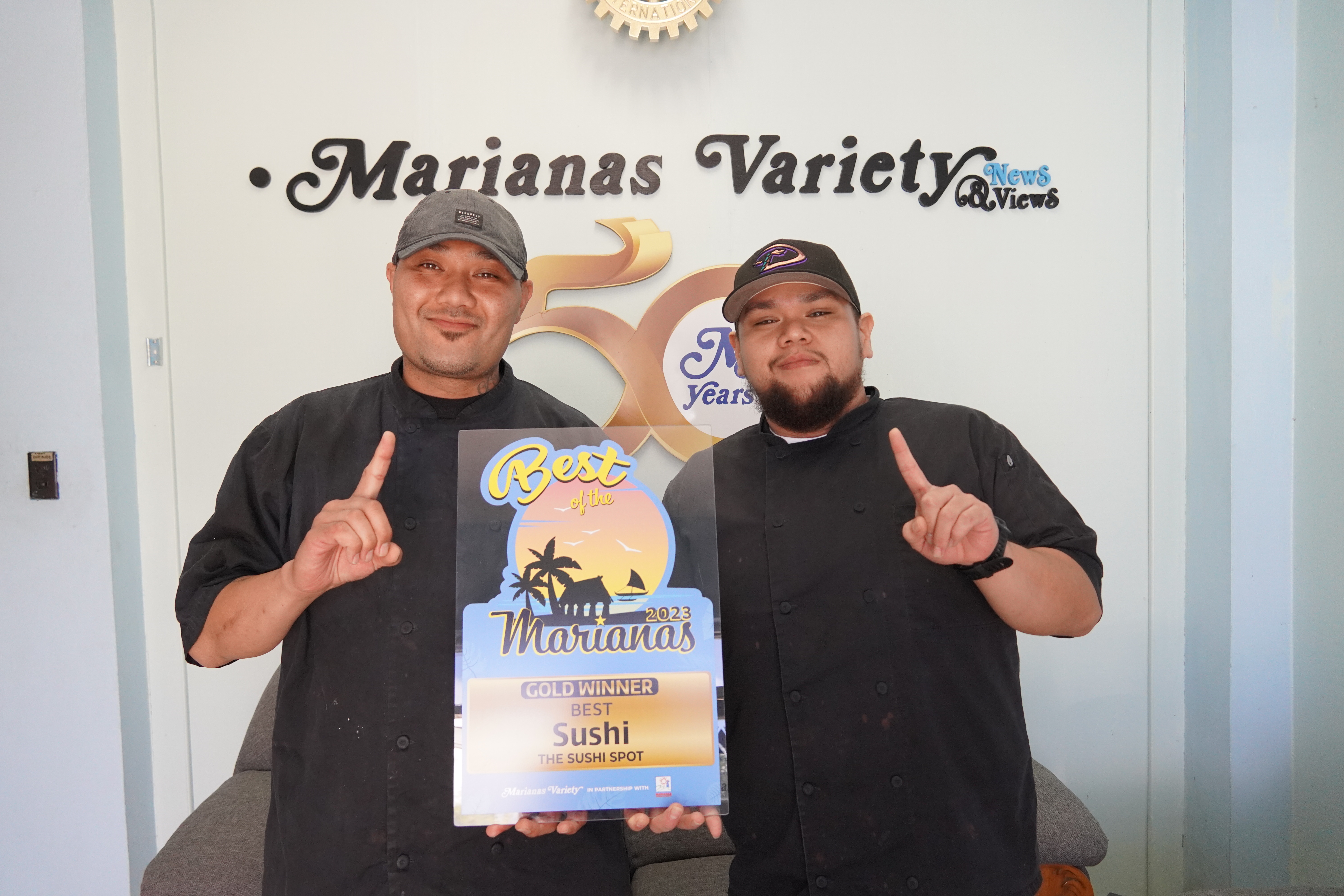 The owners and chefs of The Sushi Spot, Shane Hawley and Joaquin Villagomez, receive the gold award for Best Sushi.