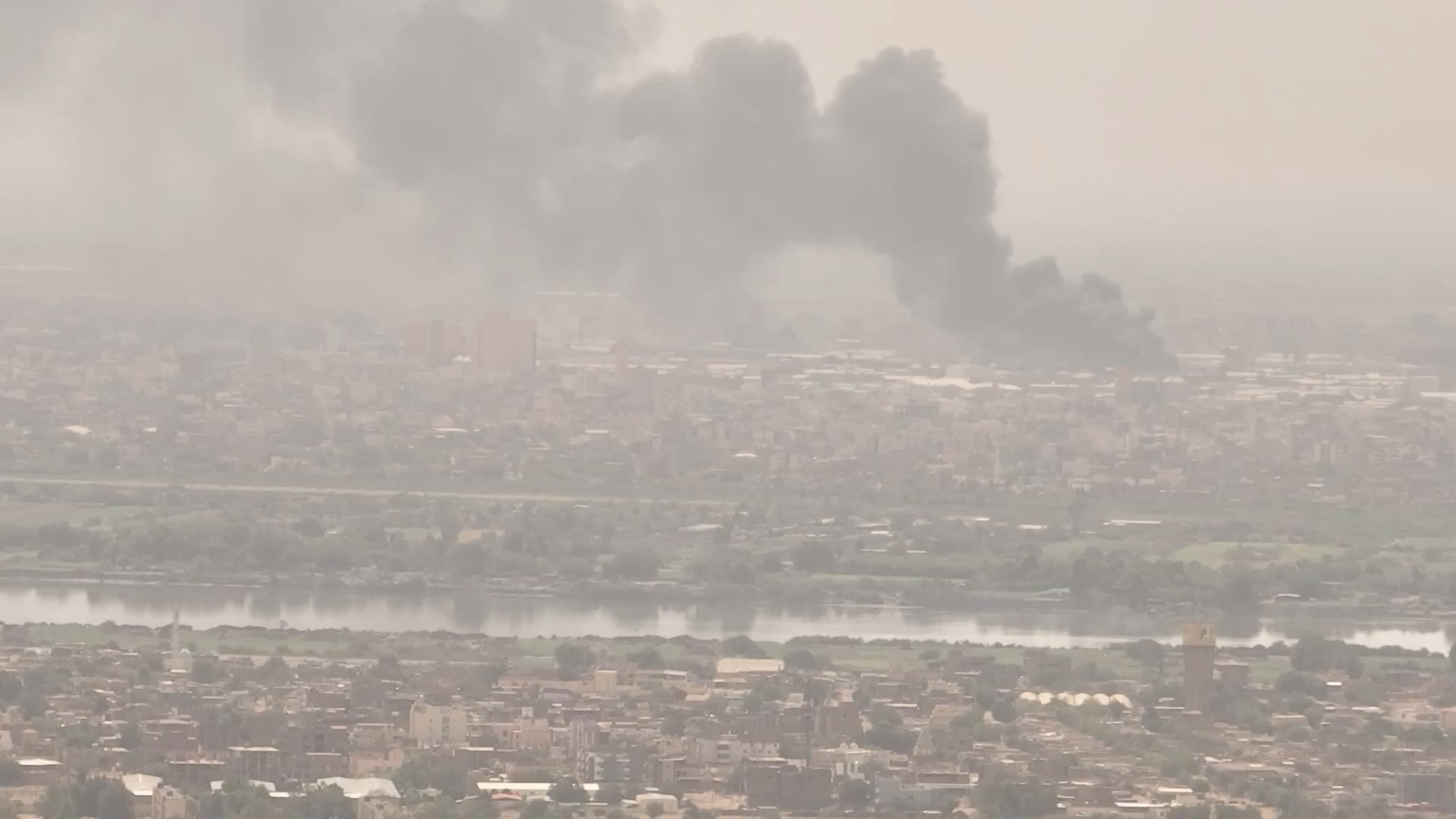 Plums of smoke rise amidst clashes between the paramilitary Rapid Support Forces and the army, in Bahri, Khartoum North (filmed from Omdurman), Sudan April 28, 2023, in this screen grab from a social media video. Video Obtained by REUTERS