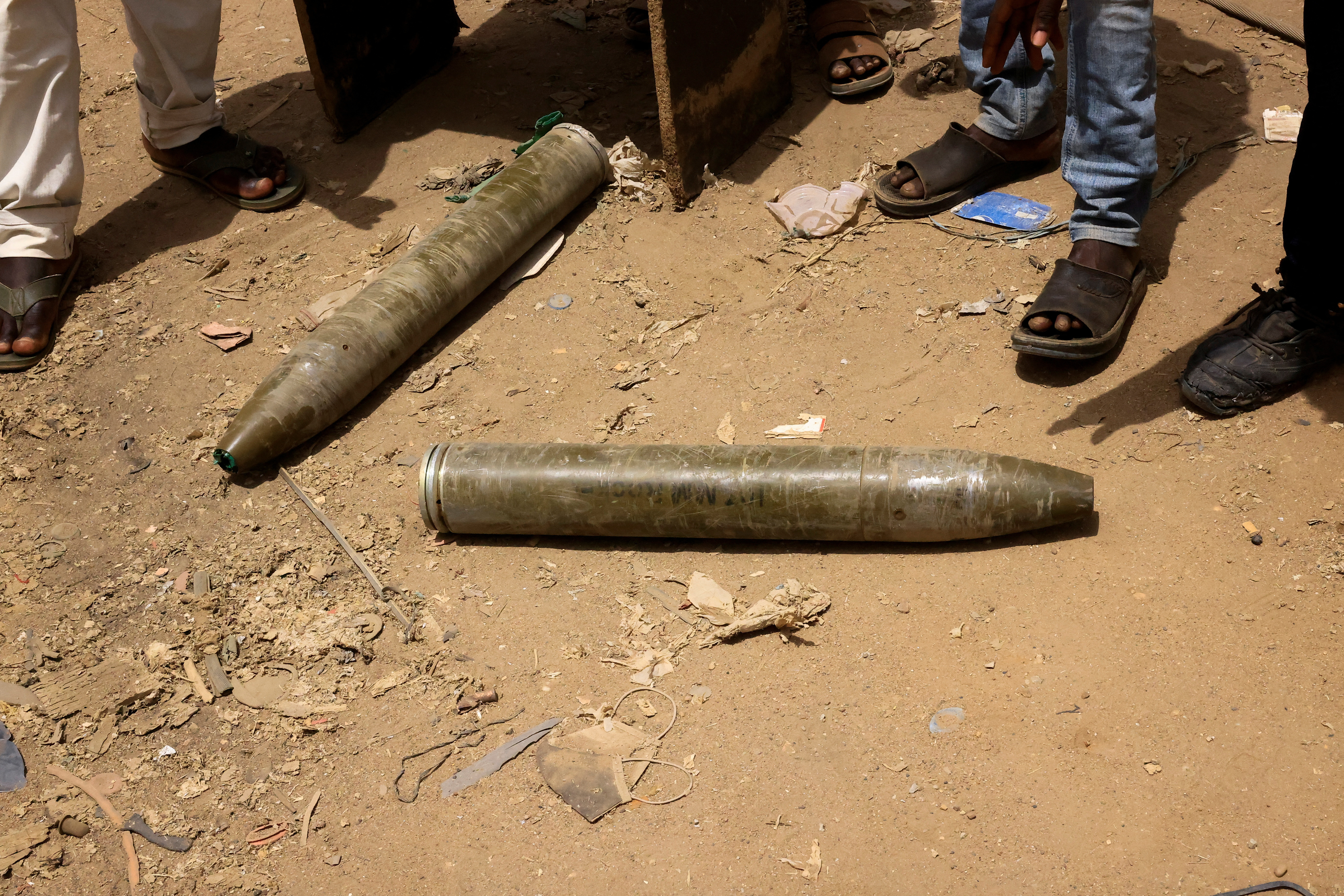 Shells are seen on the ground near damaged buildings at the central market during clashes between the paramilitary Rapid Support Forces and the army in Khartoum North, Sudan. April 27, 2023. REUTERS/ Mohamed Nureldin Abdallah