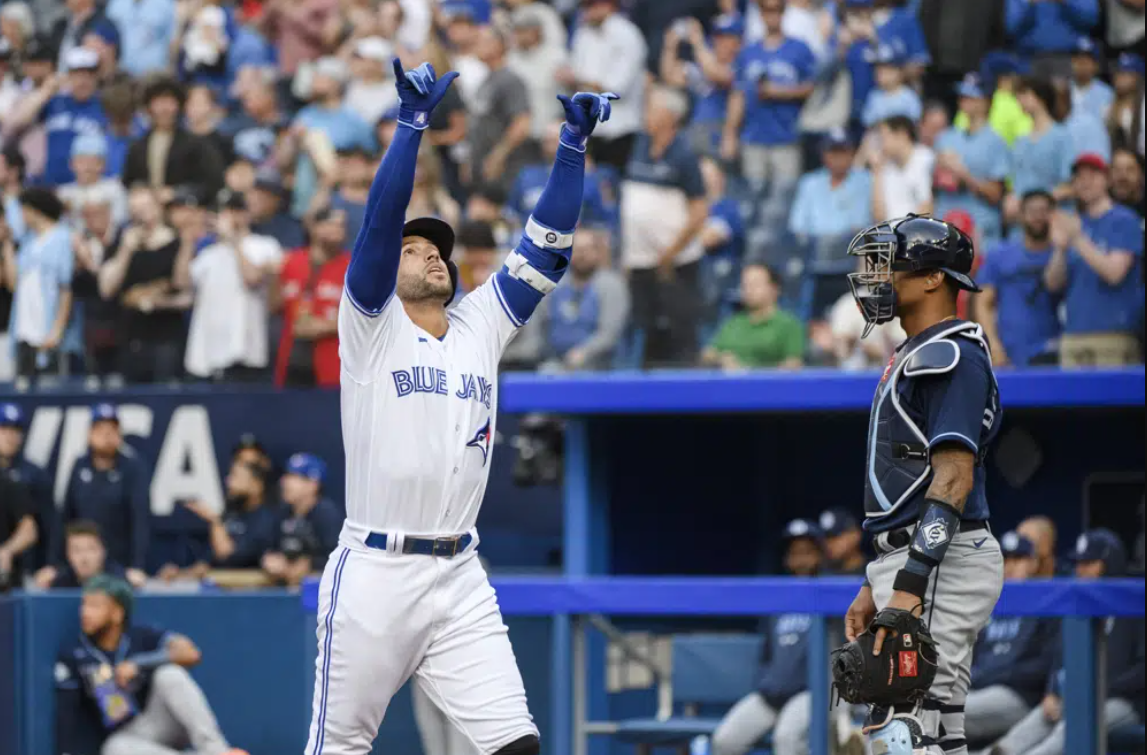Toronto Blue Jays' George Springer celebrates after hitting a solo home run against the Tampa Bay Rays during the first inning of a baseball game Friday, April 14, 2023, in Toronto.