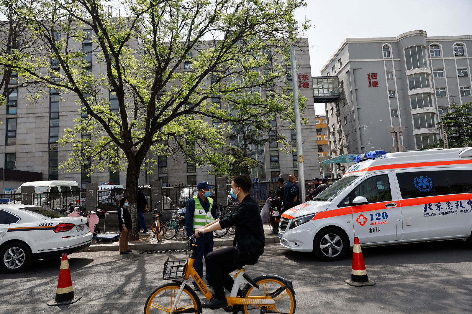 An ambulance parks outside the Changfeng Hospital following a fire, in Beijing, China April 19, 2023. REUTERS/Tingshu Wang