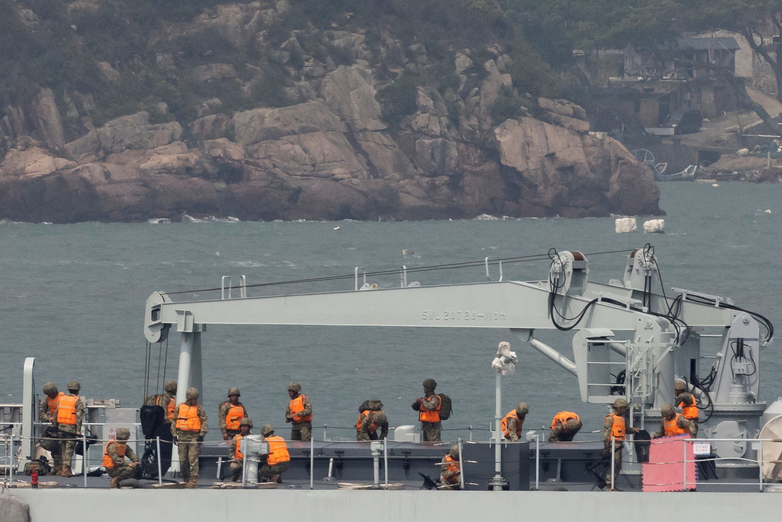 Soldiers stand on the deck of a Chinese warship as it sails during a military drill near Fuzhou, Fujian Province, near the Taiwan-controlled Matsu Islands that are close to the Chinese coast, China, April 8, 2023.
