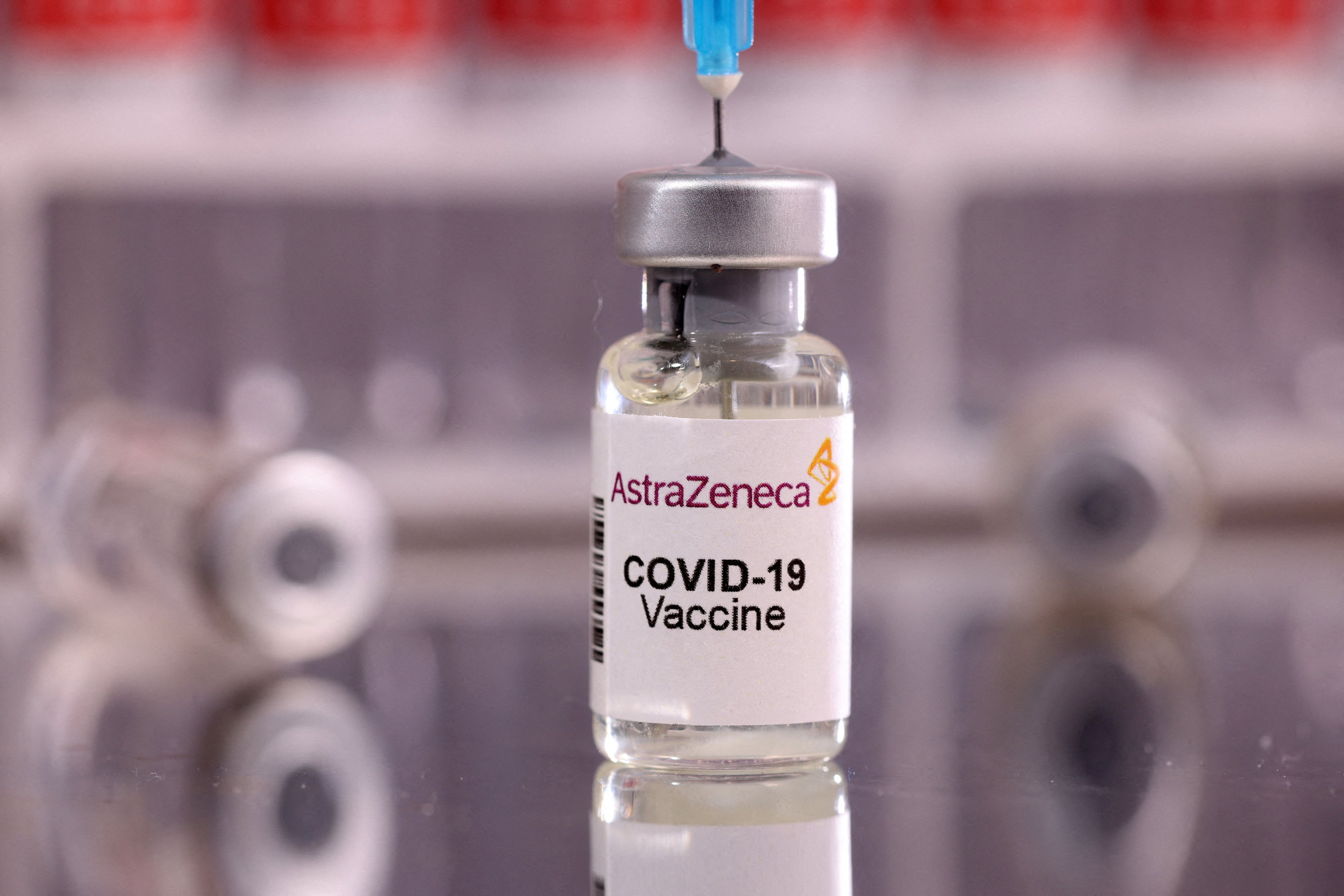 FILE PHOTO: A vial labelled "AstraZeneca COVID-19 Vaccine" is seen in this illustration taken January 16, 2022. REUTERS/Dado Ruvic/Illustration/File Photo