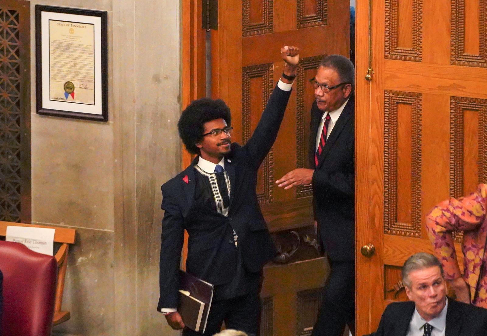 Rep. Justin Pearson gestures while entering the statehouse, as Republicans who control the Tennessee House of Representatives prepare to vote on whether to expel three Democratic members for their role in a gun control demonstration at the statehouse last week, in Nashville, Tennessee, April 6, 2023.