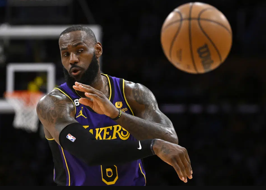 Los Angeles Lakers forward LeBron James passes the ball during the second half of an NBA basketball game against the Phoenix Suns Friday, April 7, 2023, in Los Angeles.