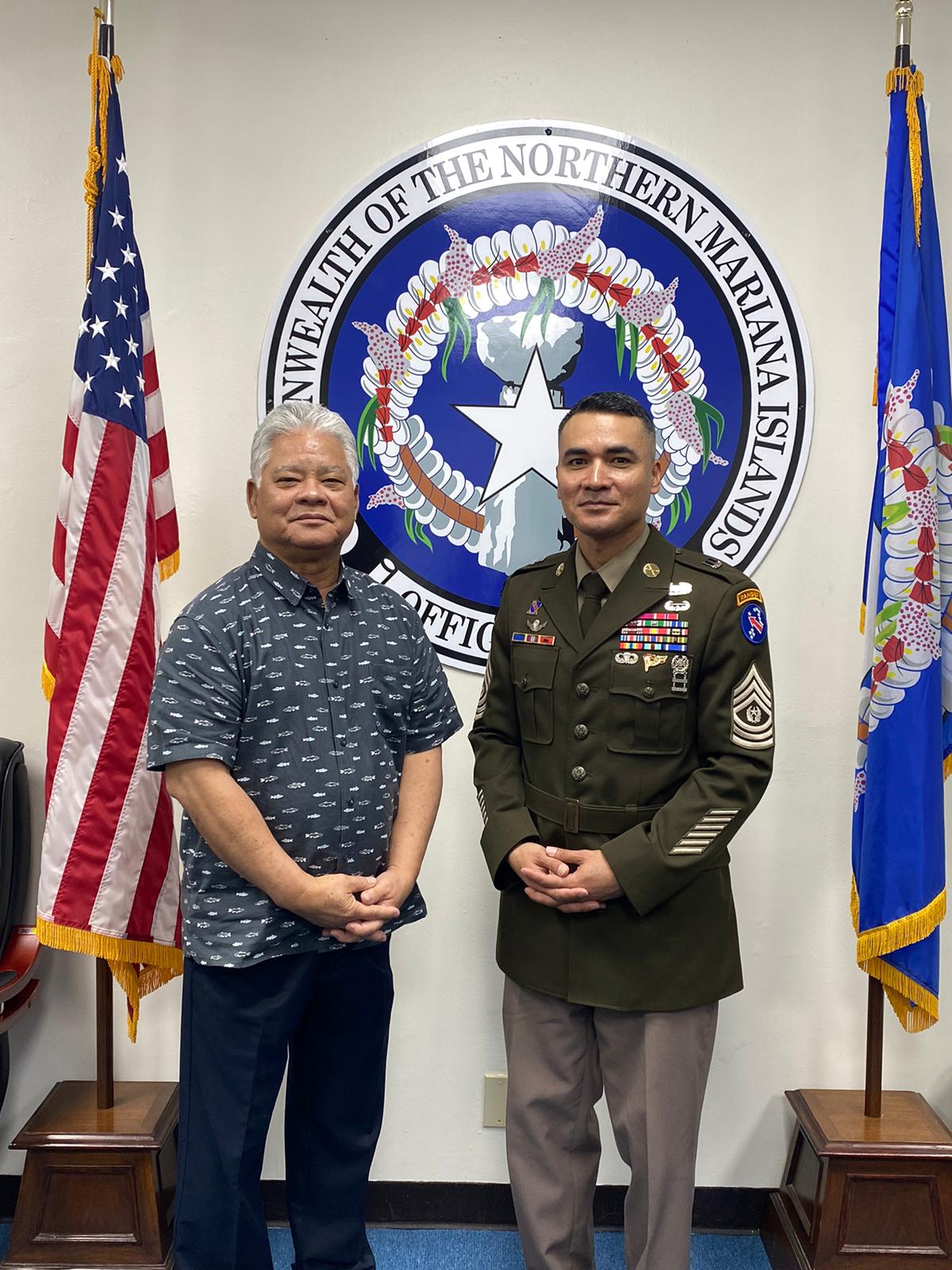 Command Sgt. Maj. Sebastian Atalig Camacho, right, with Gov. Arnold I. Palacios at the governor's office on Monday.