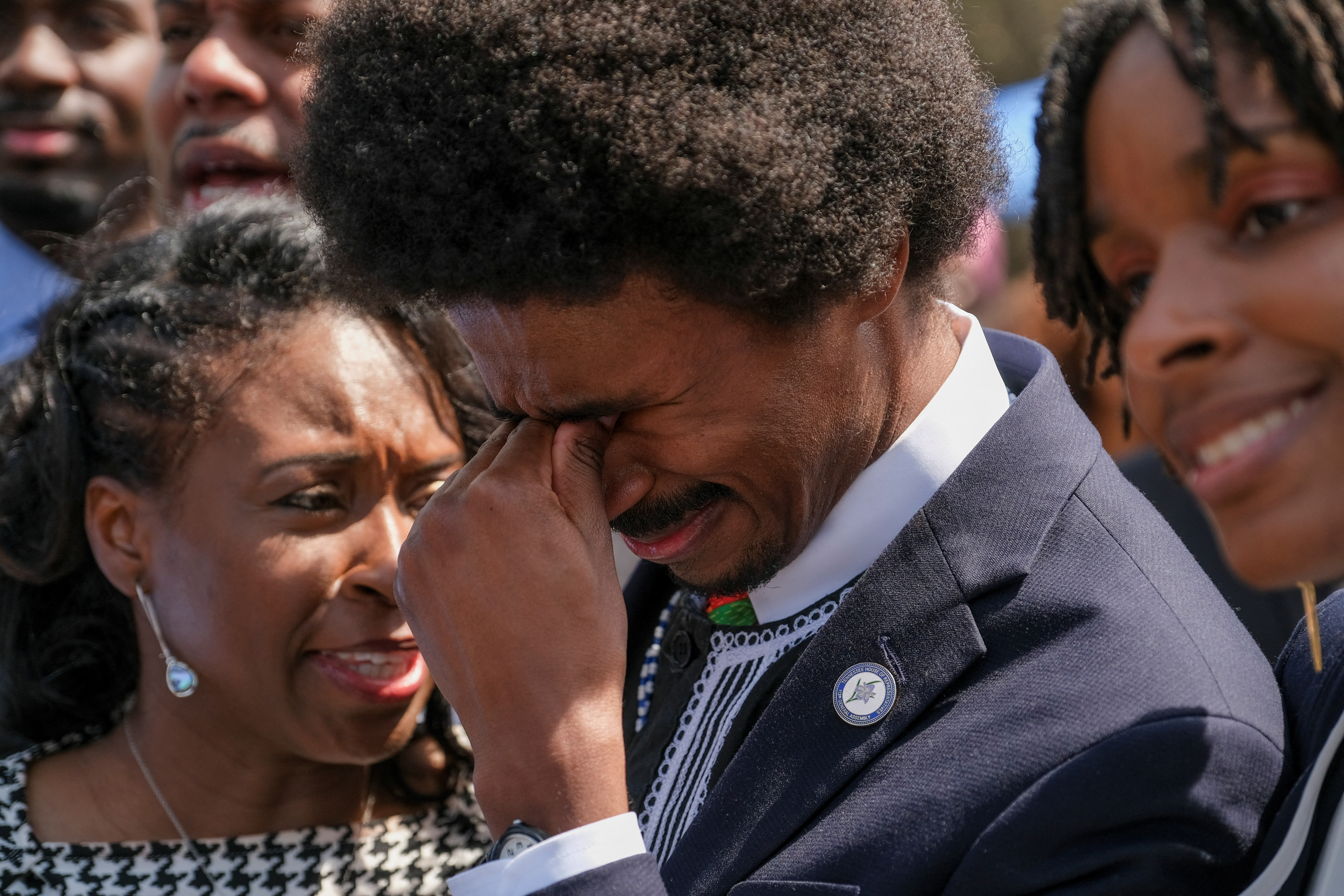 Justin Pearson gets emotional with his parents after his reinstatement in Nashville, Tennessee, U.S. April 13, 2023. REUTERS/Kevin Wurm