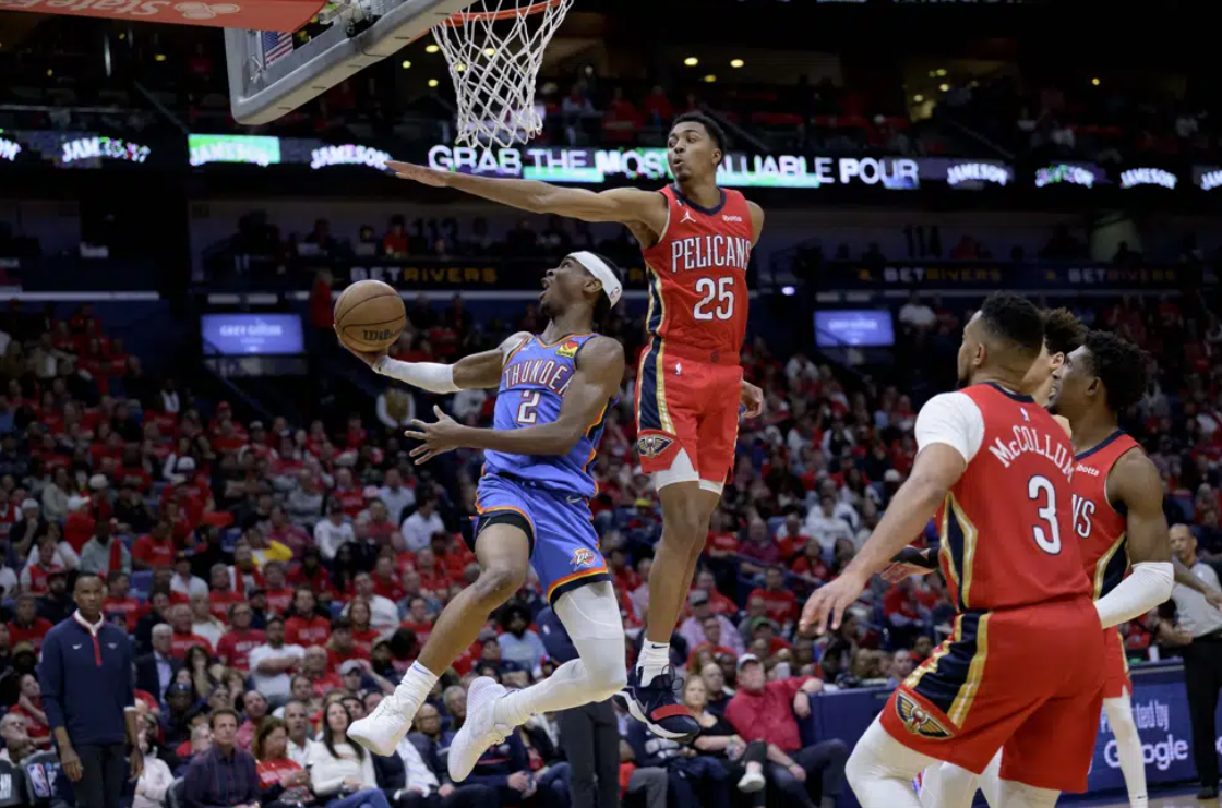 Oklahoma City Thunder guard Shai Gilgeous-Alexander (2) shoots against New Orleans Pelicans guard Trey Murphy III (25) during the second half of an NBA basketball play-in tournament game in New Orleans, Wednesday, April 12, 2023.