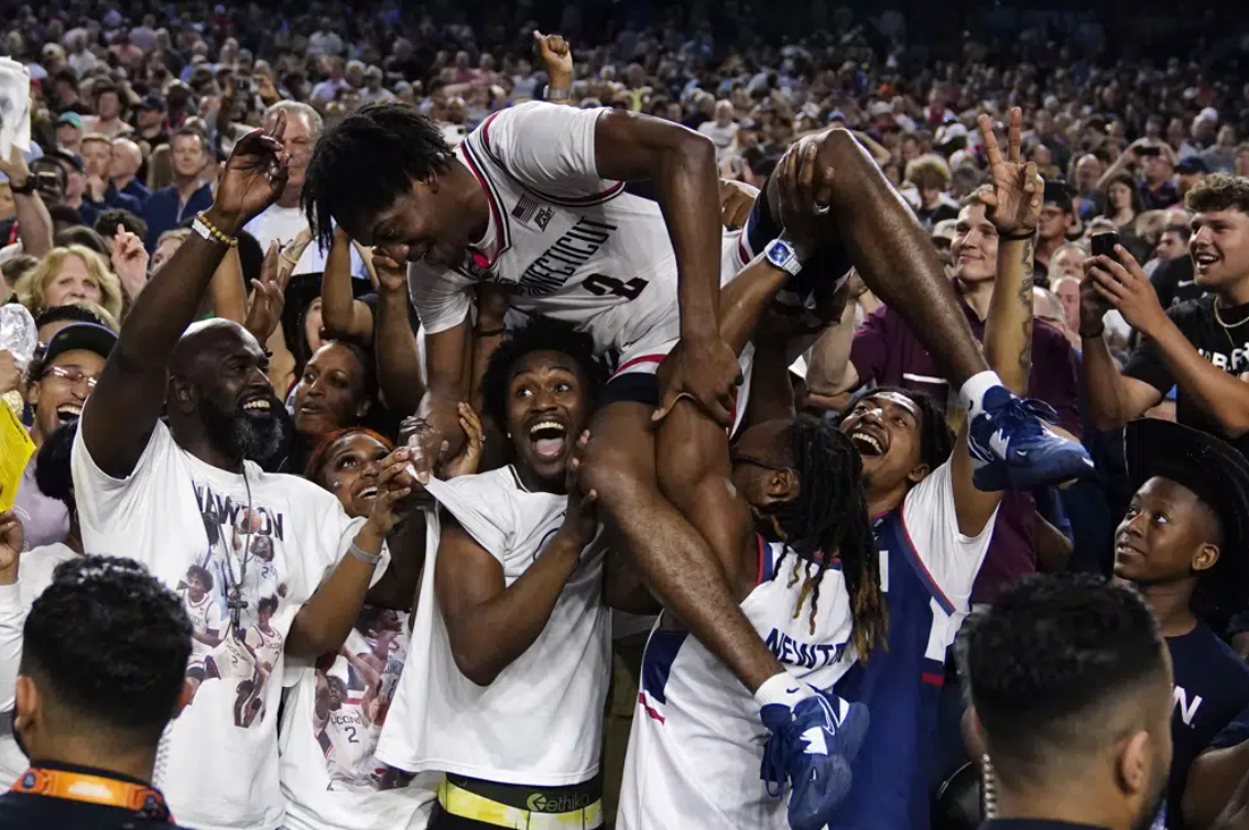 Connecticut guard Tristen Newton celebrates after their win against San Diego State during the men's national championship college basketball game in the NCAA Tournament on Monday, April 3, 2023, in Houston.