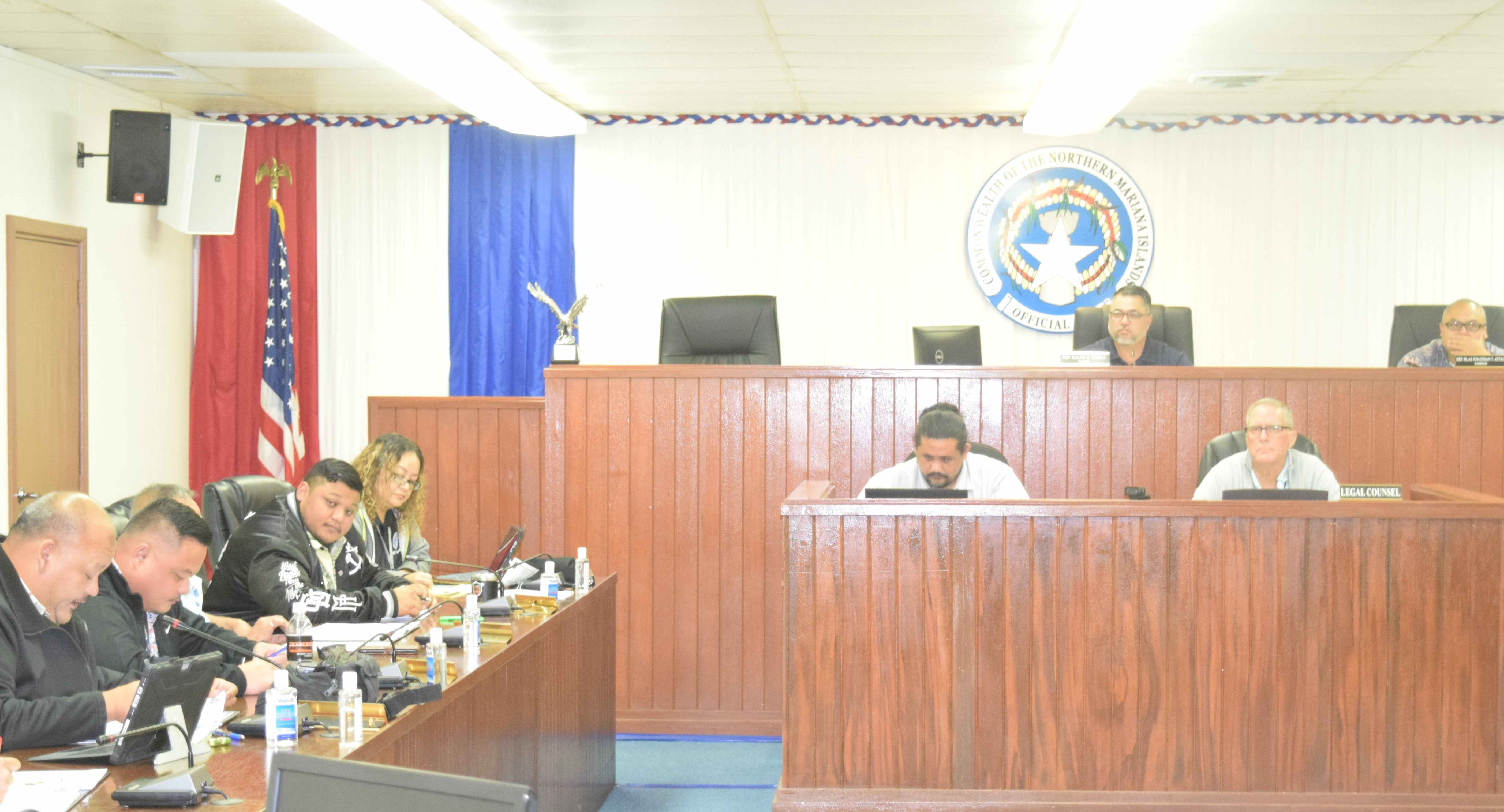 House Ways and Means Committee Chair Ralph Yumul, third right, Rep. Blas Jonathan Attao, right, and other members convene on Tuesday in the House chamber.