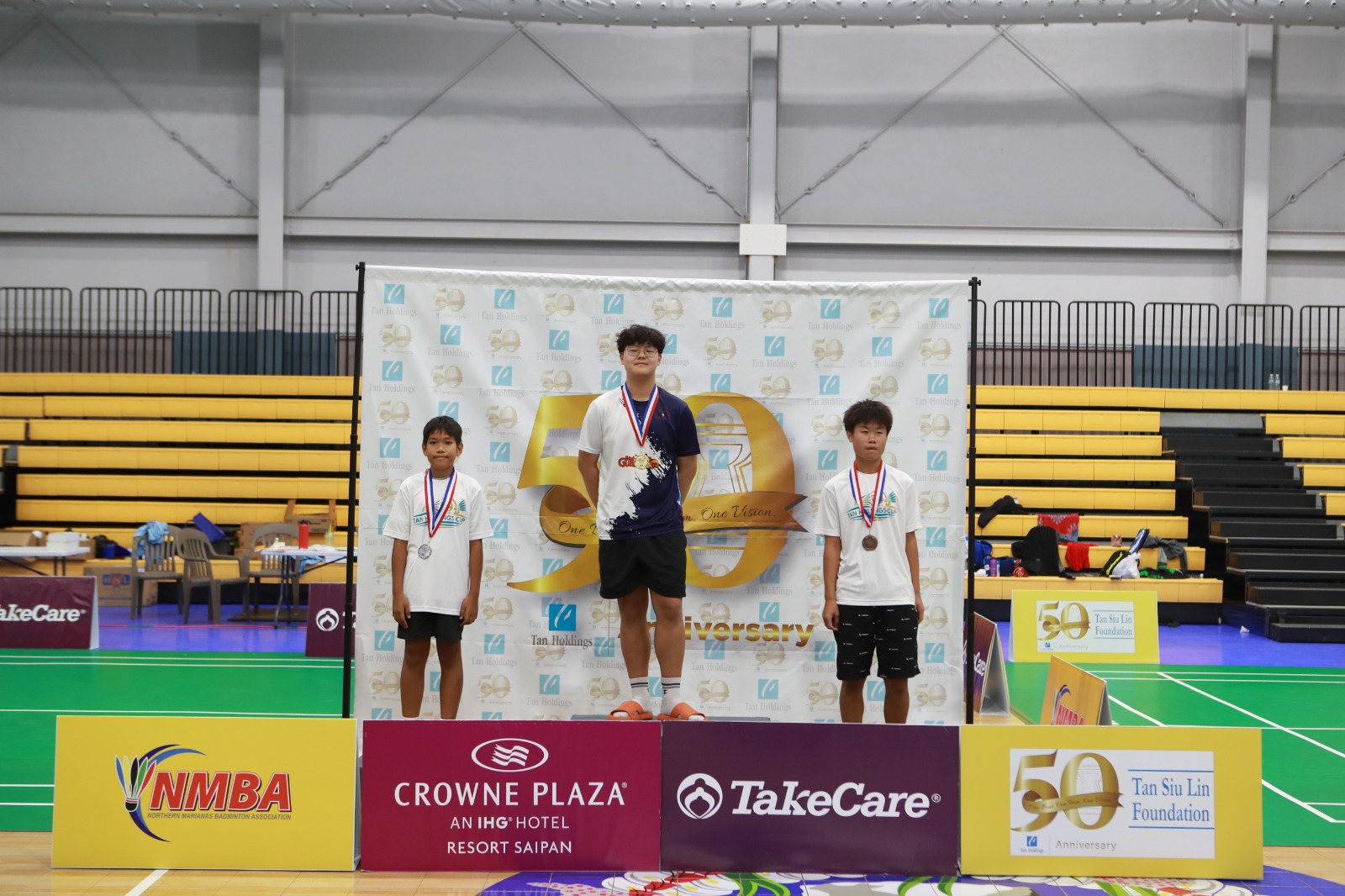 Johnson Xia, center, Evan Seguritan, and Andre Zapata are the top three U15 boys singles players in the Tan Holdings Cup at the Ada gym.