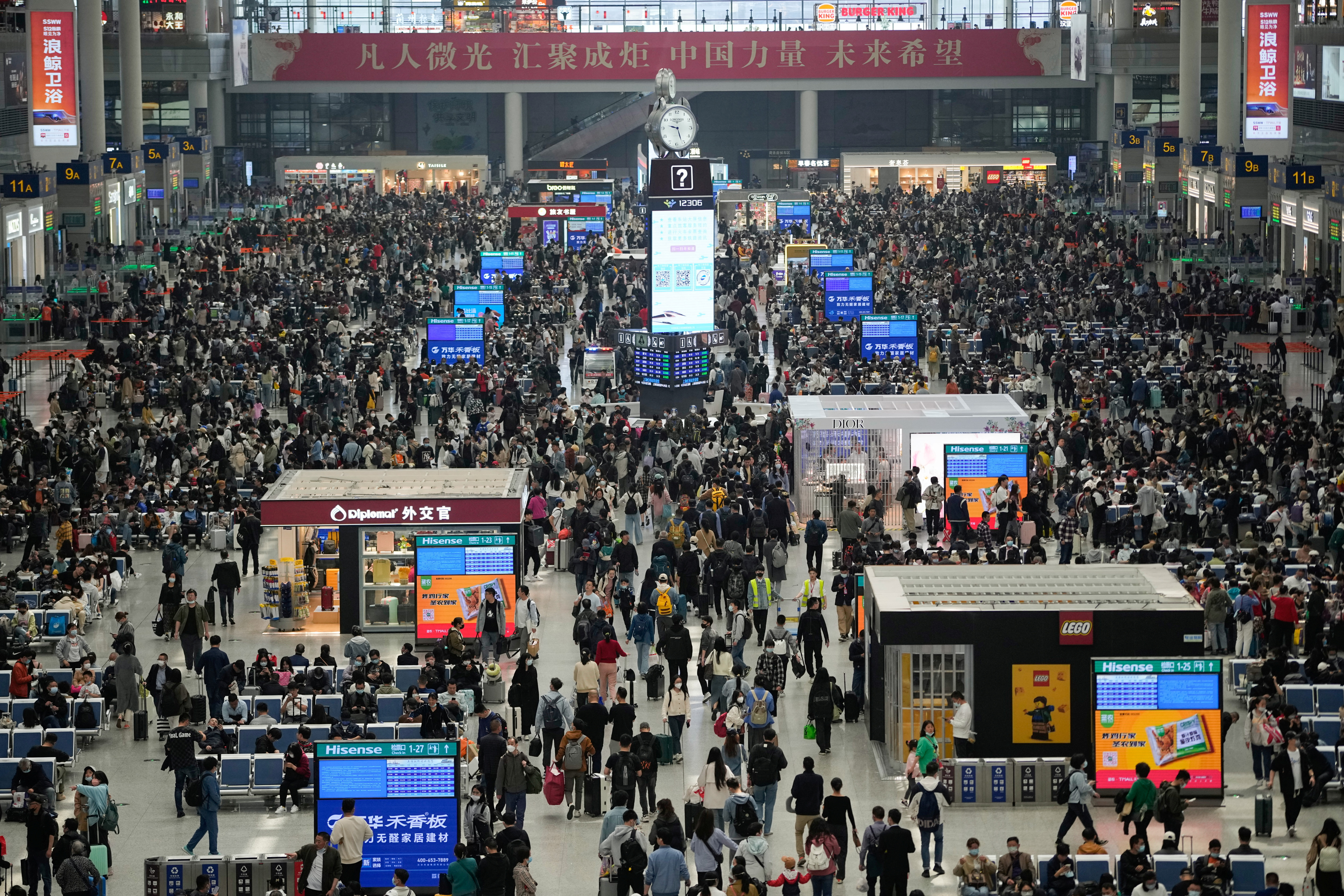 Passengers wait to board trains at Shanghai Hongqiao railway station ahead of the five-day Labor Day holiday, in Shanghai, China, April 28, 2023. REUTERS/Aly Song