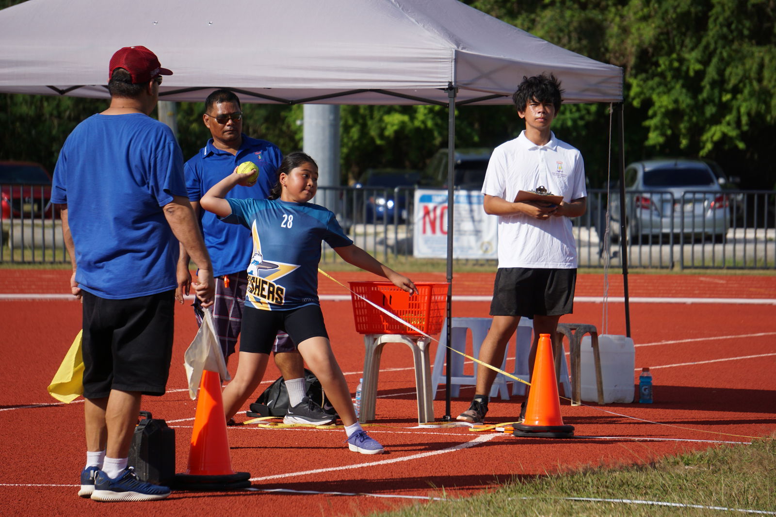 A WSR student attempts the softball throw in the U9 girls division of the PSS-NMA All School Athletics on Friday at the Oleai Sports Complex.