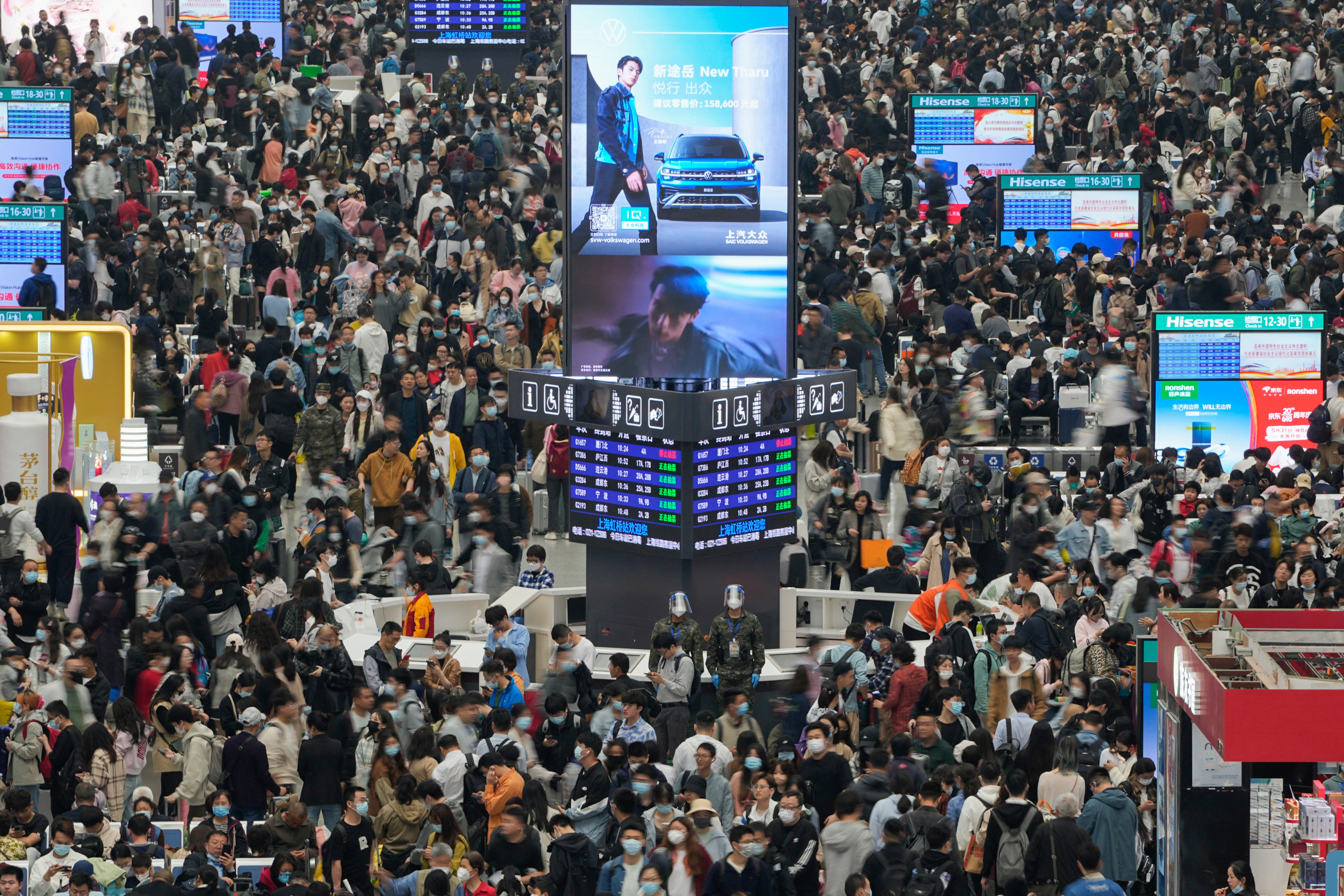 Passengers wait to board trains at Shanghai Hongqiao railway station ahead of the five-day Labor Day holiday, in Shanghai, China, April 28, 2023. REUTERS/Aly Song