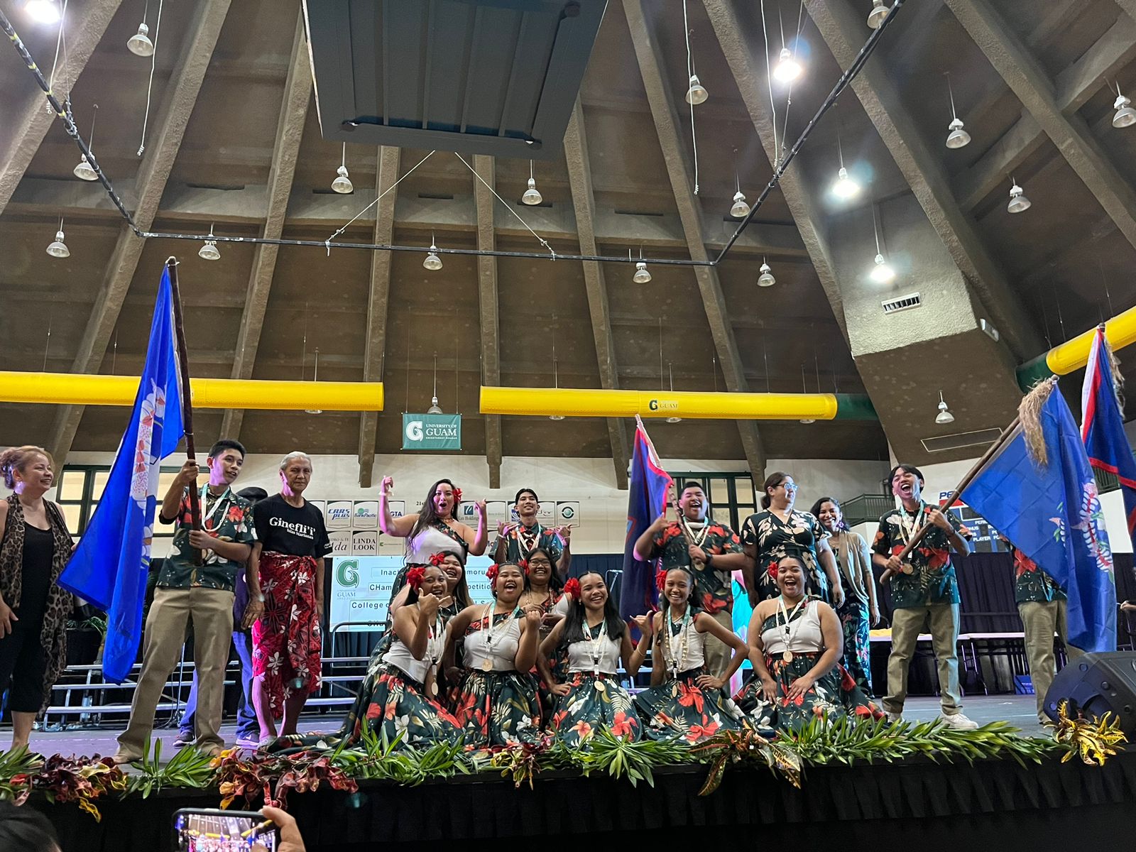 Marianas High School delegates and coaches cheer and pose for photos after winning first place in Kanta yan Baila/Song and Dance at Inacha'igen Fino' CHamoru 2023.