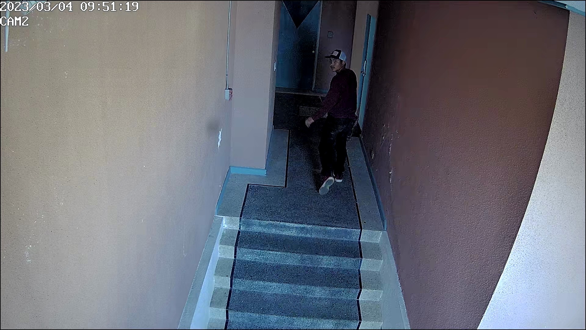 An individual makes his way to Hideaki Sawada's office. He would later try to force his way into the office.