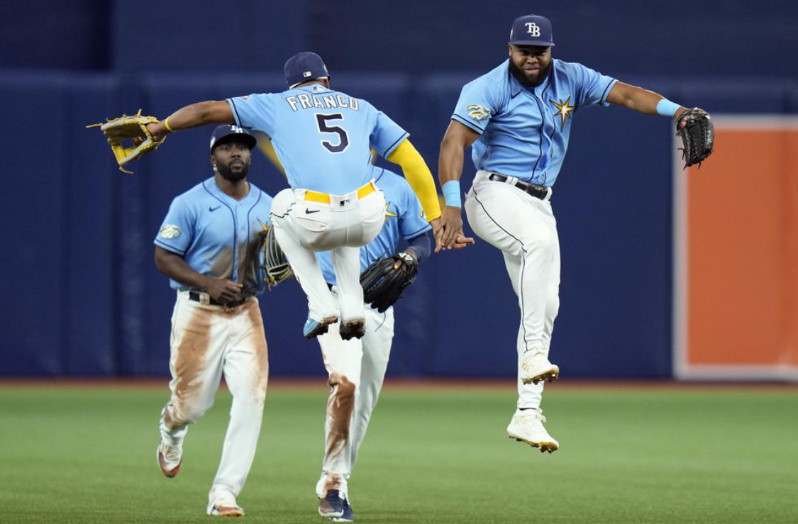Tampa Bay Rays outfielder Manuel Margot celebrates with shortstop Wander Franco (5) after the Rays defeated the Boston Red Sox during a baseball game Monday, April 10, 2023, in St. Petersburg, Fla.