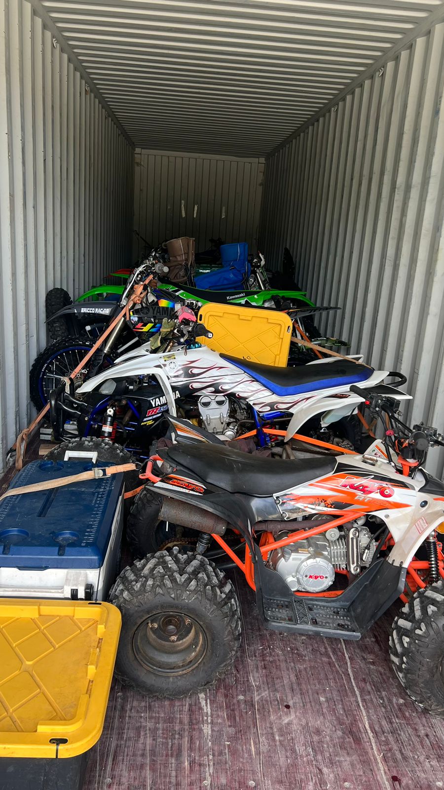 Marianas Racing Association members' bikes are loaded into a container van headed to Guam.