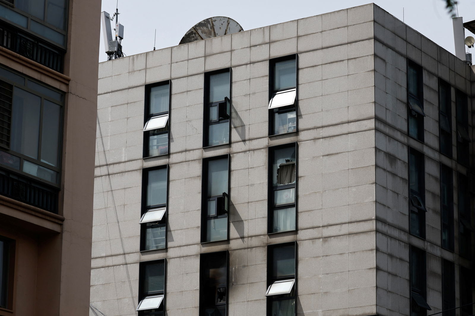 Damaged windows are seen following a fire at the Changfeng Hospital, in Beijing, China April 19, 2023. REUTERS/Tingshu Wang