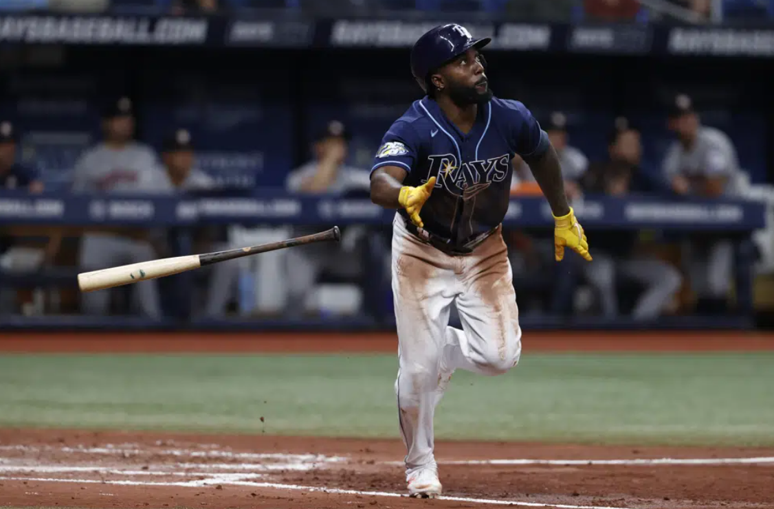 Tampa Bay Rays' Randy Arozerena hits a sacrifice fly to right field against the Houston Astros during the third inning of a baseball game Monday, April 24, 2023, in St. Petersburg, Fla.