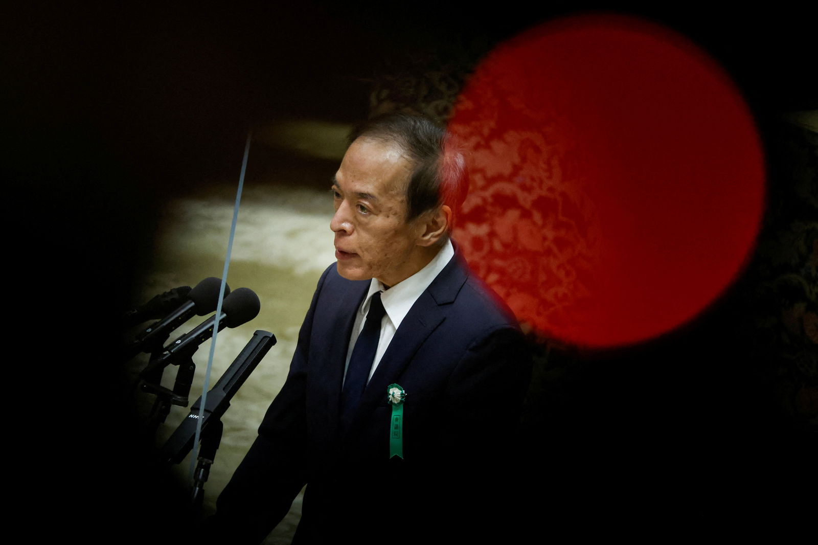 FILE PHOTO: The Japanese government's nominee for the Bank of Japan (BOJ) Governor Kazuo Ueda speaks during a hearing session at the lower house of the parliament in Tokyo, Japan, February 24, 2023. REUTERS/Issei Kato