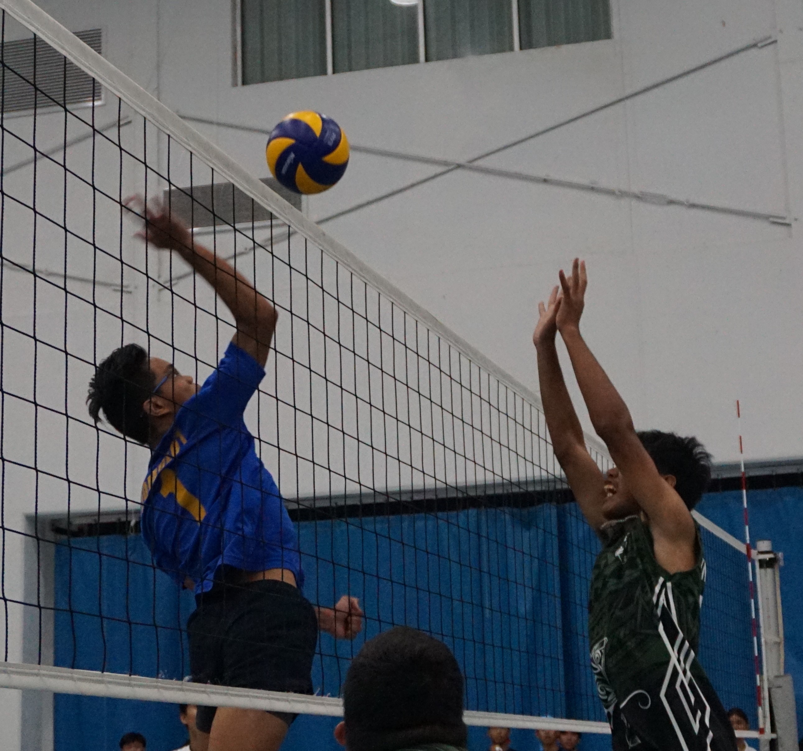MHS 2's Harry Damulot attempts the spike finish against SSHS 2 during a boys high school division game of the PSS-NMIVA Interscholastic Volleyball League at the MHS gym.