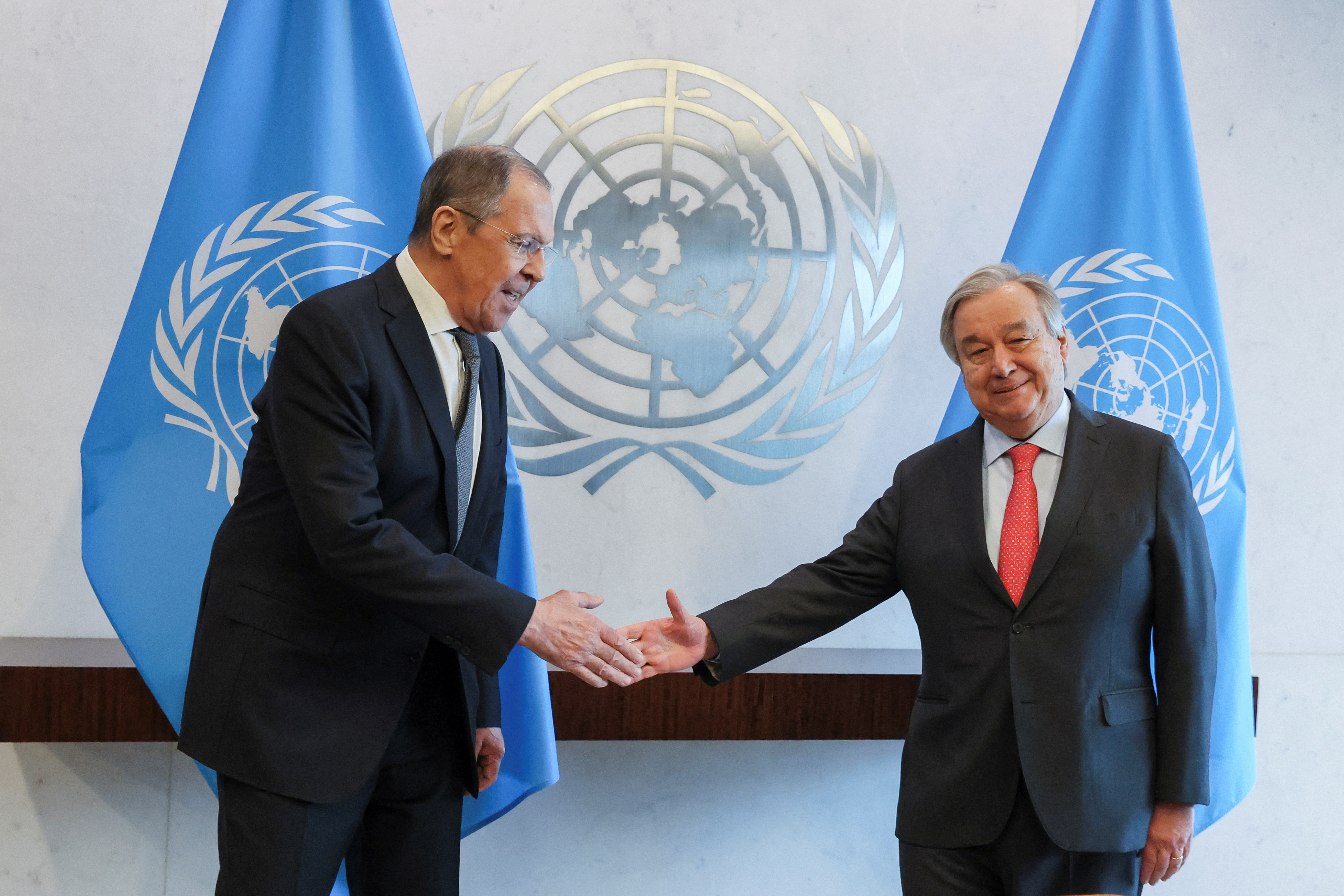 United Nations Secretary-General Antonio Guterres and Russian Foreign Minister Sergei Lavrov pose for photos as they attended a meeting of the United Nations Security Council on "Effective multilateralism through the defence of the principles of the Charter of the United Nations," at the U.N. headquarters in New York, U.S., April 24, 2023. REUTERS/Brendan McDermid
