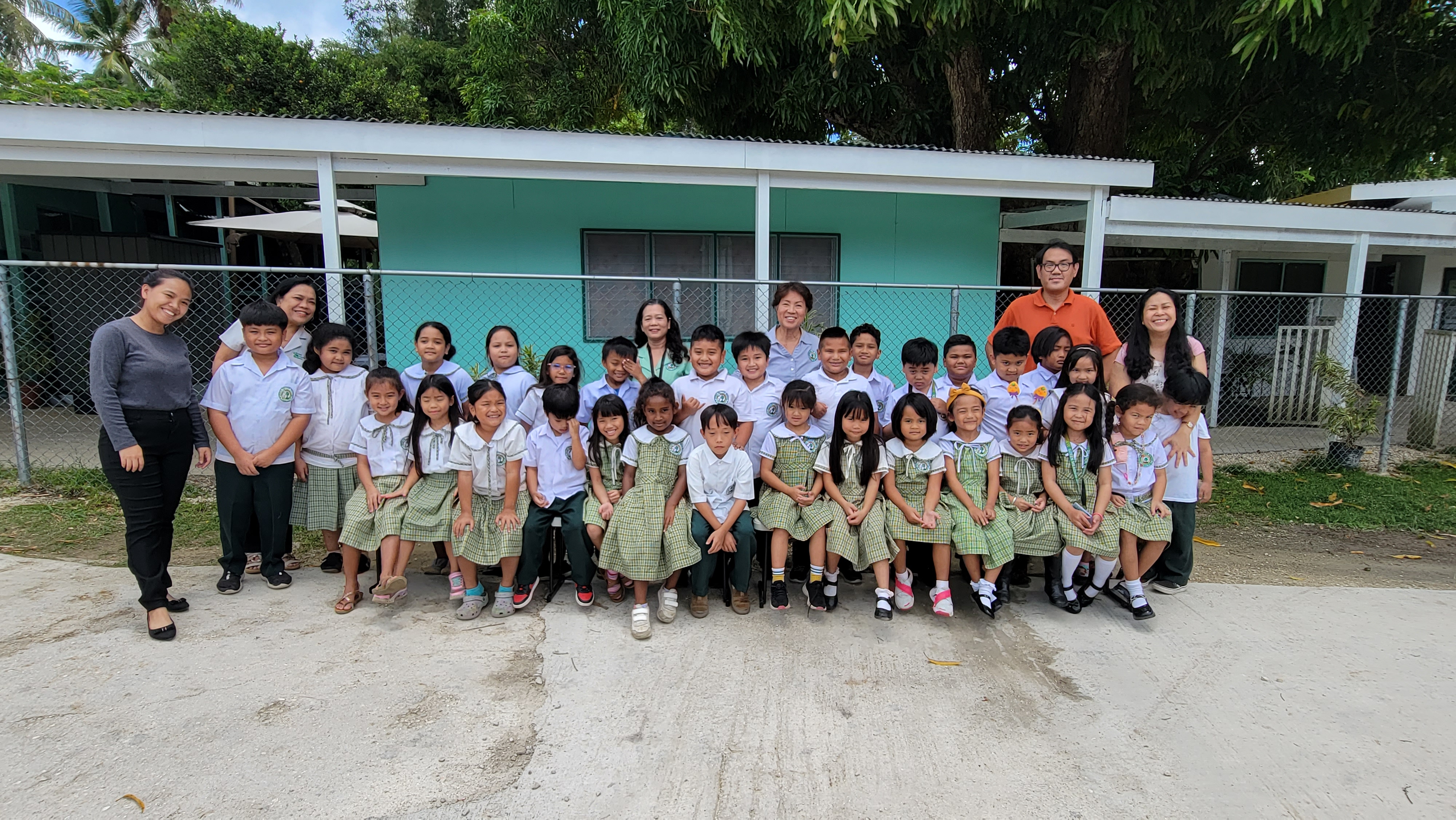 Young Falcons from the K-2 Division line up with big smiles after their great victory at the regional Primary Grade Forensic Conference.