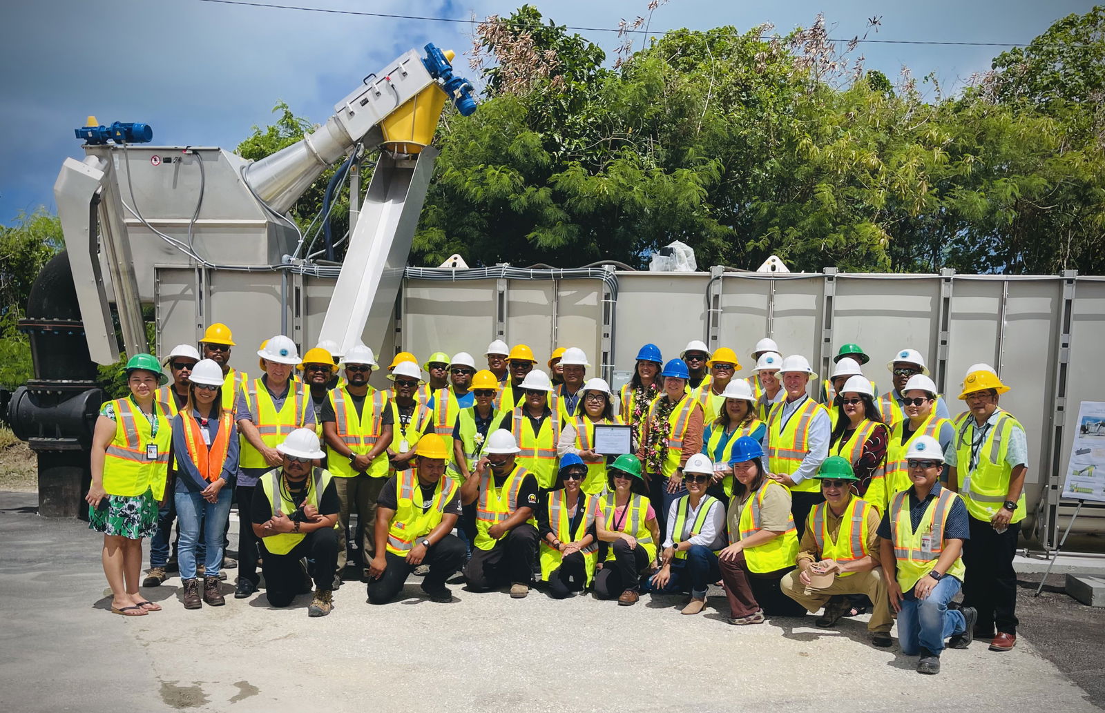Martha Guzman, regional administrator of the U.S. Environmental Protection Agency, Region 9, and senior EPA staff, pose for a photo with Commonwealth Utilities Corporation officials and wastewater operators.