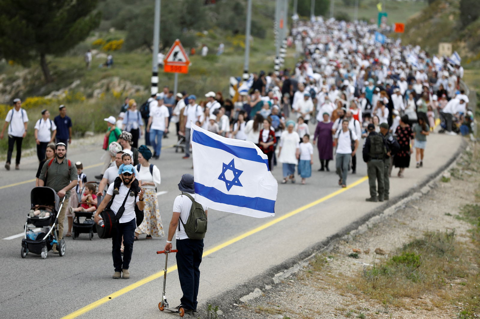 Israeli settlers hold a protest march from Tapuach Junction to the Israeli settler outpost of Evyatar, in the Israeli-occupied West Bank, April 10, 2023. REUTERS/Nir Elias