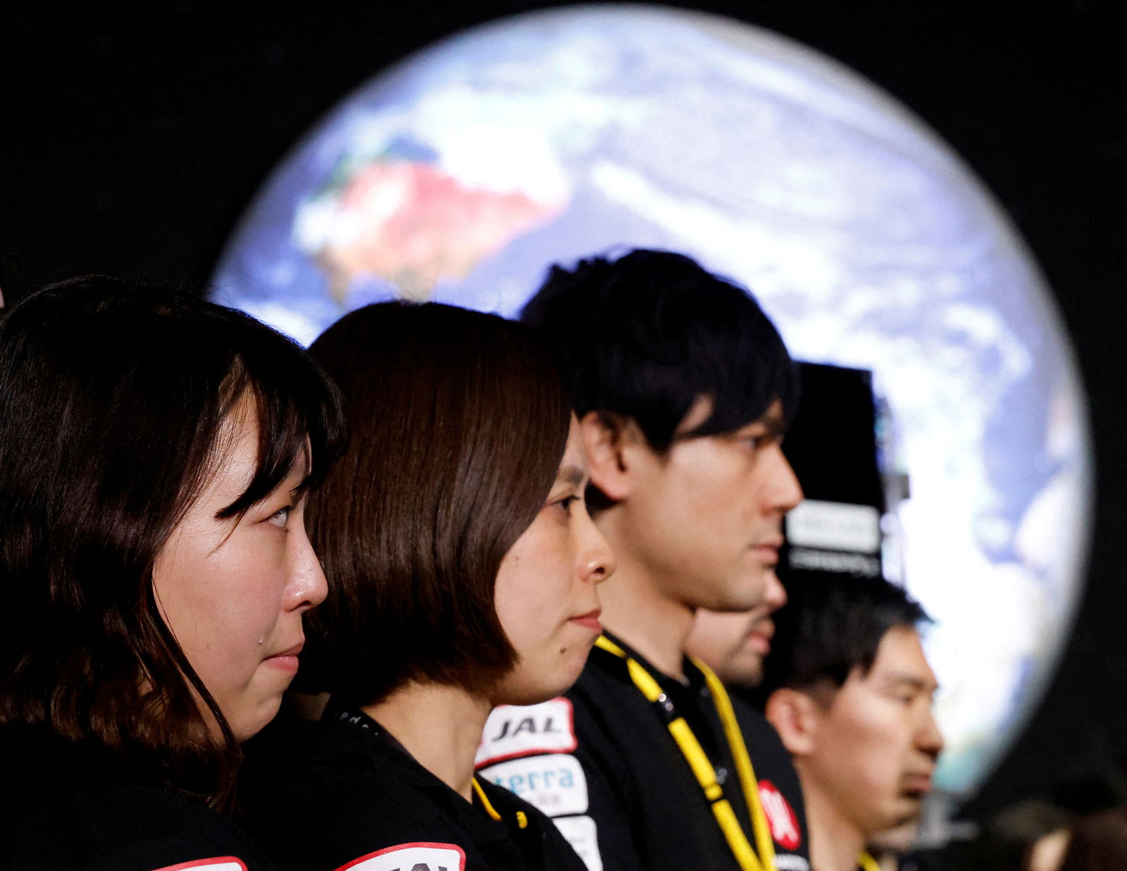 Employees of "ispace" react after the company announced they lost signal from the lander in HAKUTO-R lunar exploration program on the Moon at a venue to watch its landing in Tokyo, Japan, April 26, 2023. REUTERS/Kim Kyung-Hoon