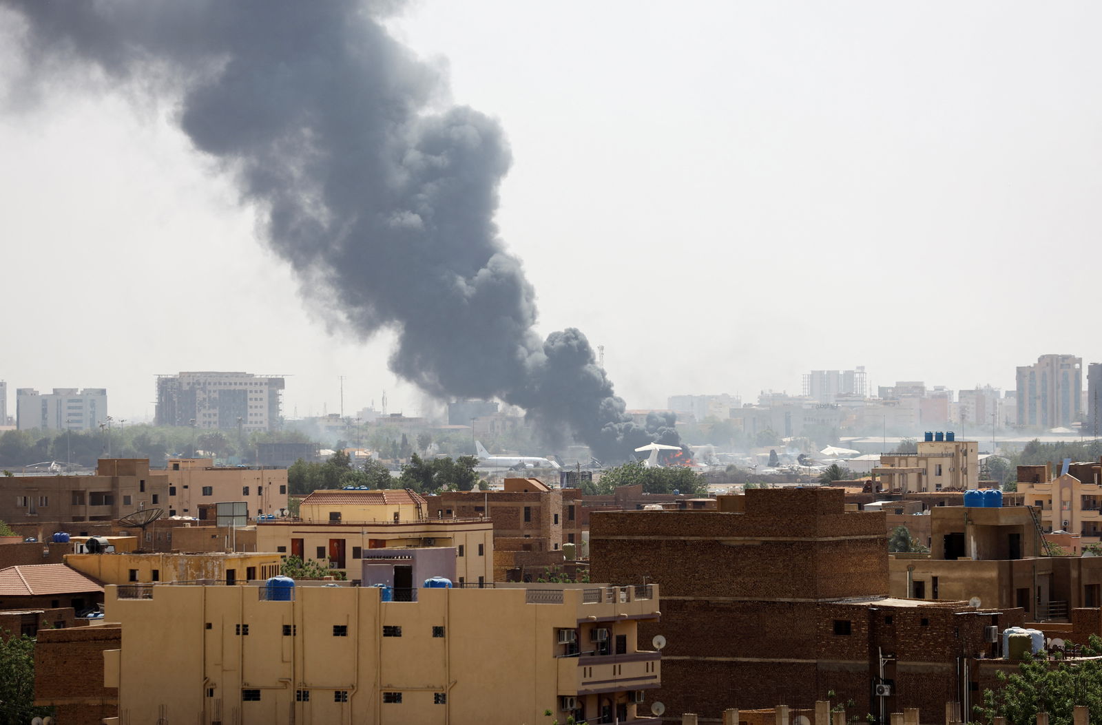 Smoke rises from burning aircraft inside Khartoum Airport during clashes between the paramilitary Rapid Support Forces and the army in Khartoum, Sudan April 17, 2023. REUTERS/Stringer