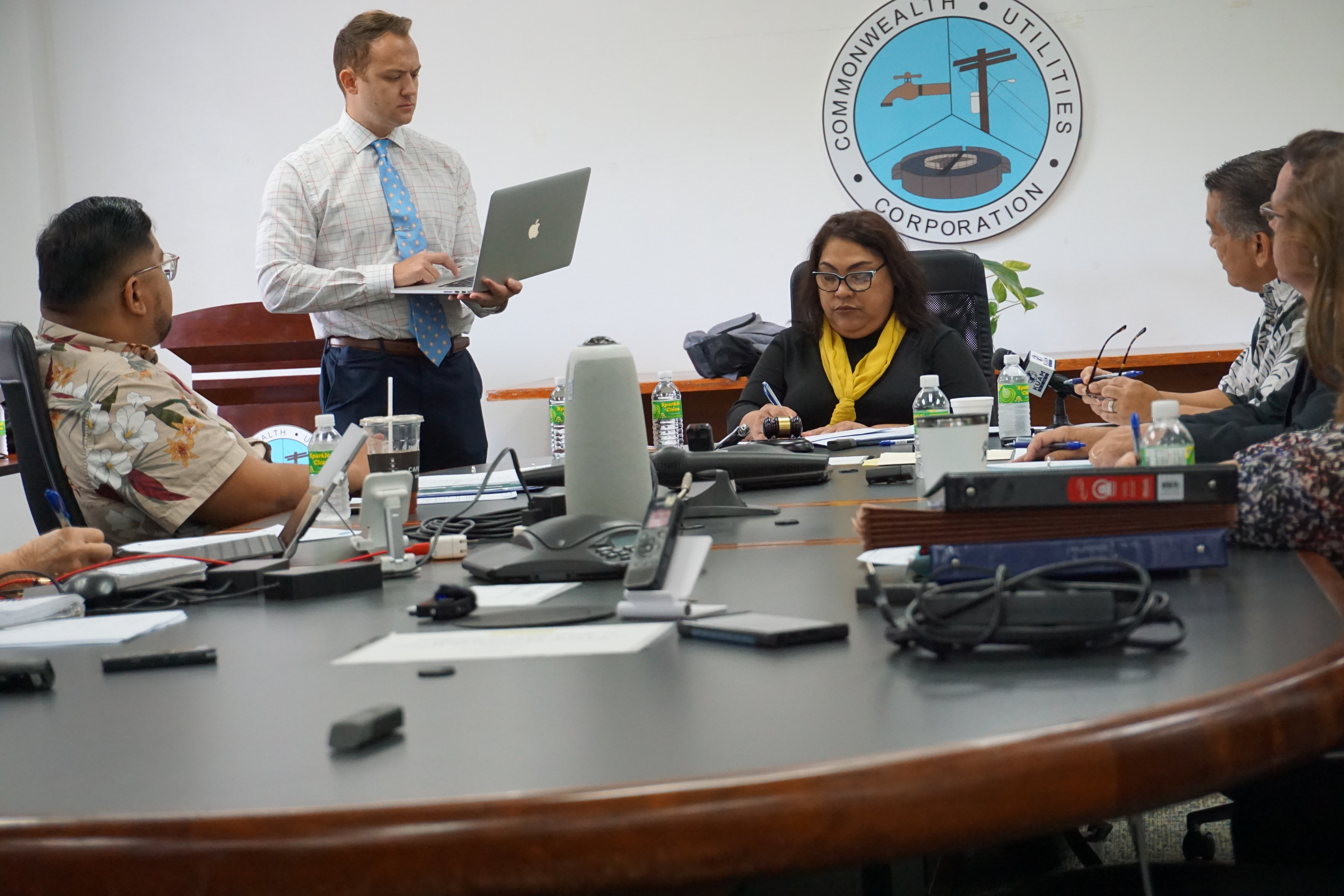 Commonwealth Utilities Corp. legal counsel Hunter Hunt, standing, holding a laptop, with board members Janice Tenorio, Frank Lee Borja, Allen Perez and Don Browne, Also in the photo is Betty Terlaje, the acting CUC executive director effective April 27.  