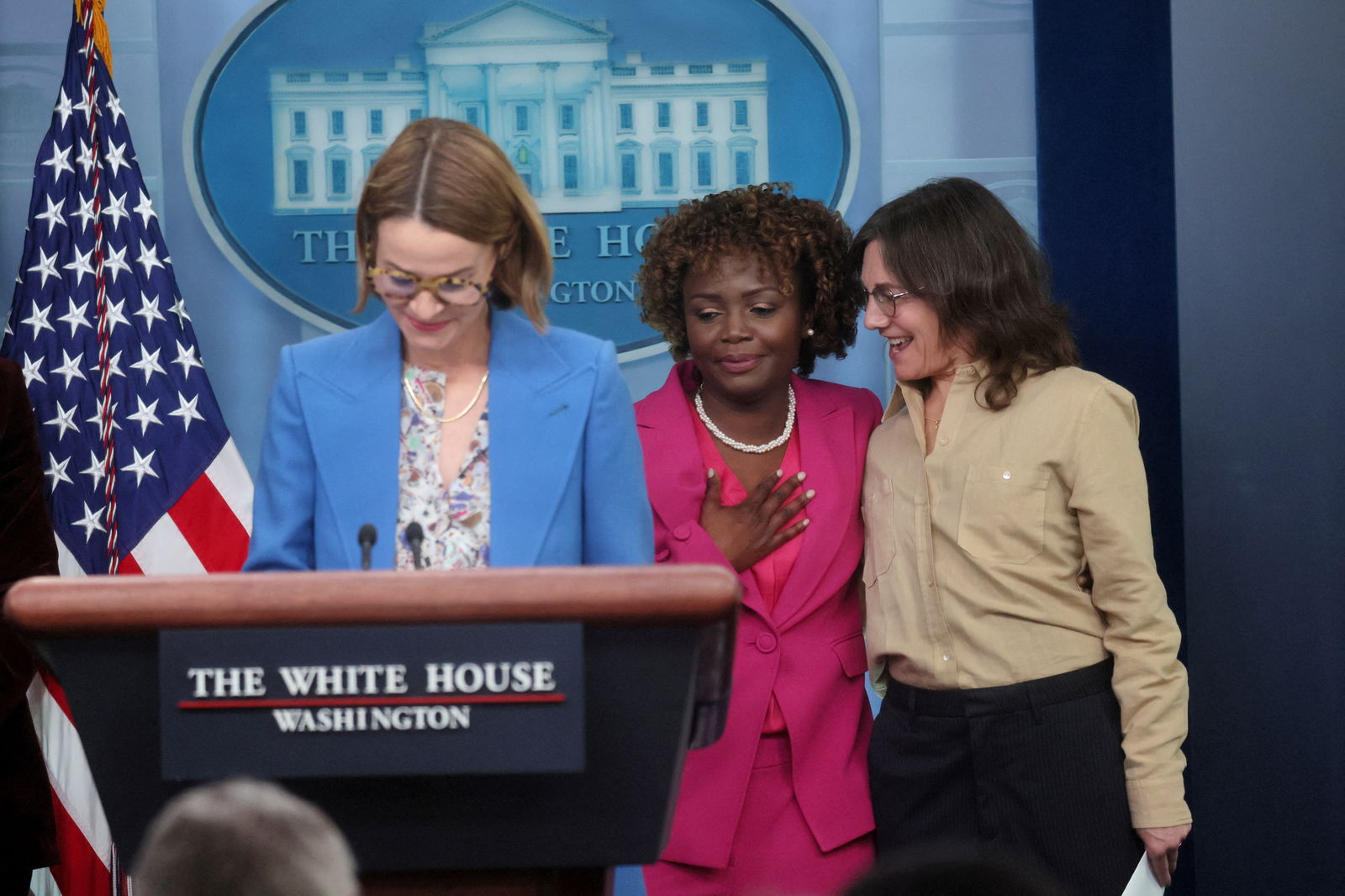 White House Press Secretary Karine Jean-Pierre hugs co-creator of the Showtime's TV show The L Word Ilene Chaiken as cast member Leisha Hailey speaks about LGBTQIA rights to draw attention to Lesbian Visibility Week during a press briefing at the White House in Washington, U.S., April 25, 2023. REUTERS/Leah Millis
