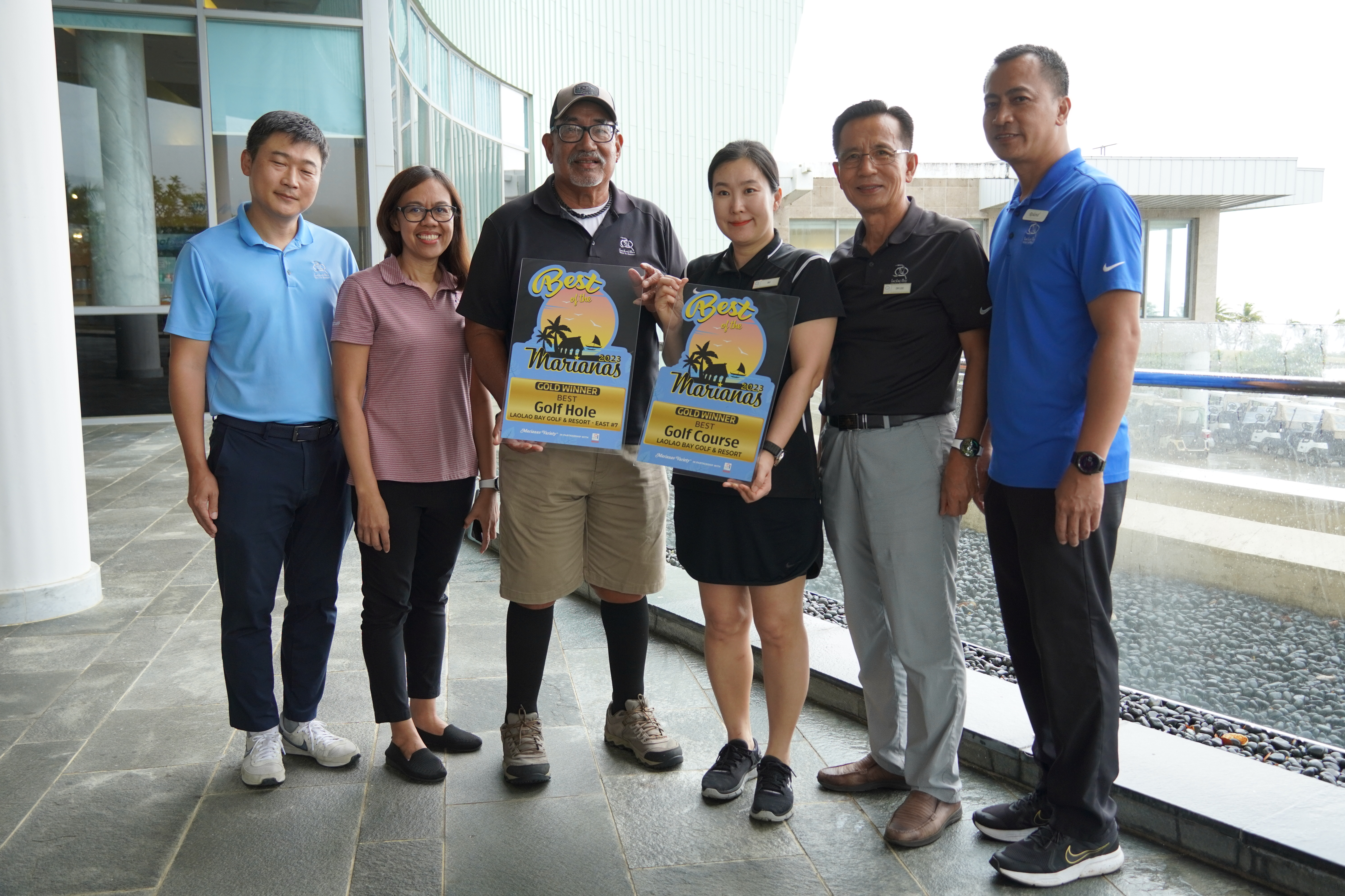 LaoLao Bay Golf & Resort's Sales and Marketing Manager Seong-uk "Joe" Jo, Accountant Maria Beltran, Operations Manager Tony Satur, Front Desk Manager Su Hyun Jung, Director DH Lee, and F&B Manager Roland Fernandez receive their gold awards for Best Golf Course and Best Golf Hole - East #7.