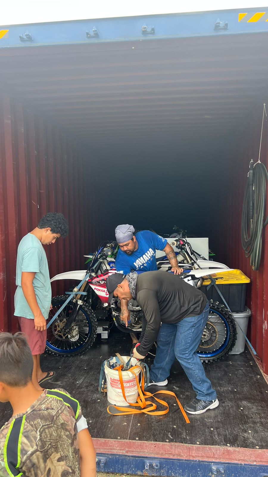 Marianas Racing Association members load bikes into a container van that will be shipped to Guam for the 40th Smokin' Wheels on April 21, 22, and 23 at the Guam International Raceway.
