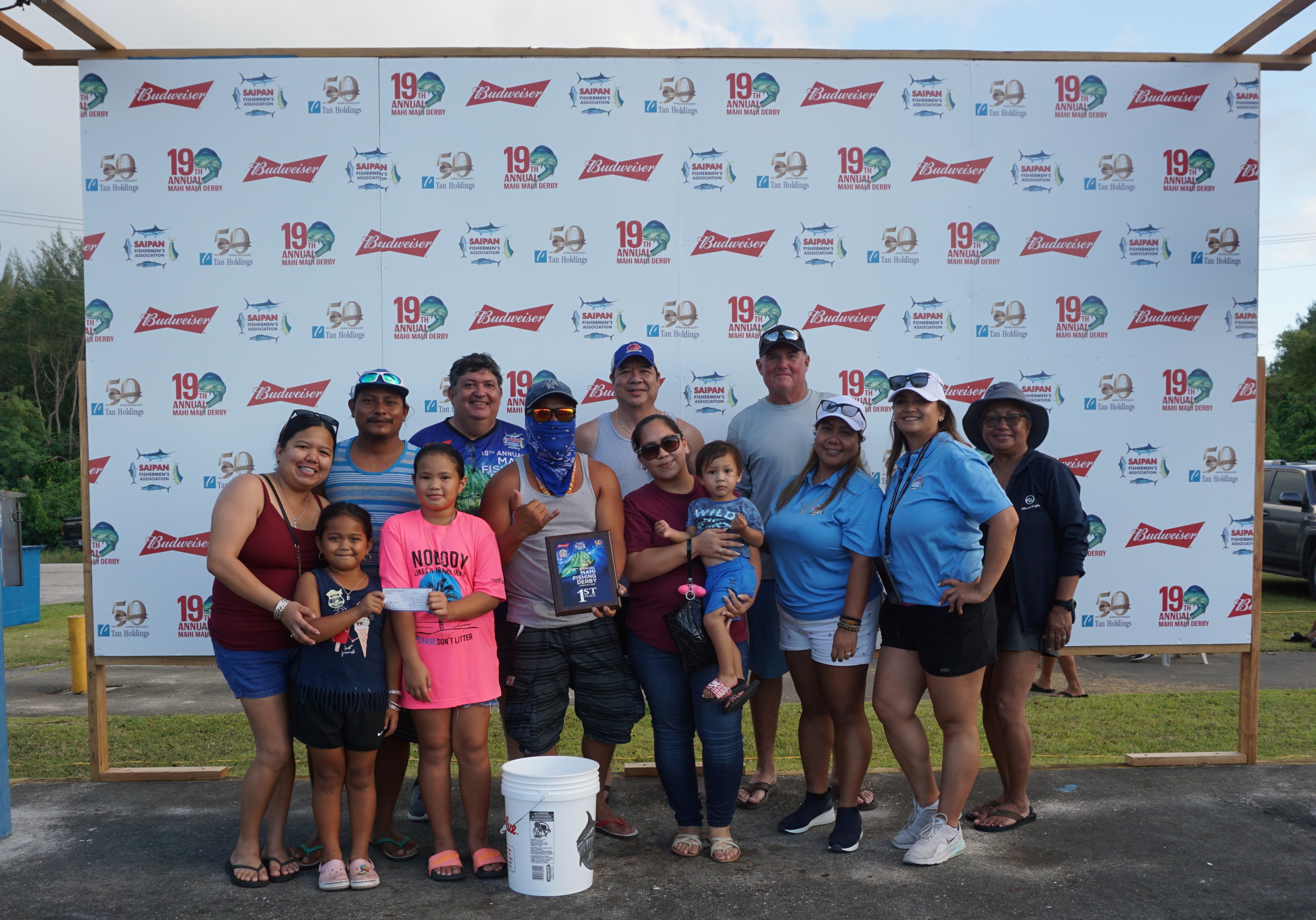 The crewmembers of 10-7 pose with their first-place plaque and check for $2,500 with SFA officials at the conclusion of the Saipan Fisherman’s Association 19th Annual Mahi Fishing Derby at  Smiling Cove Marina on Saturday.