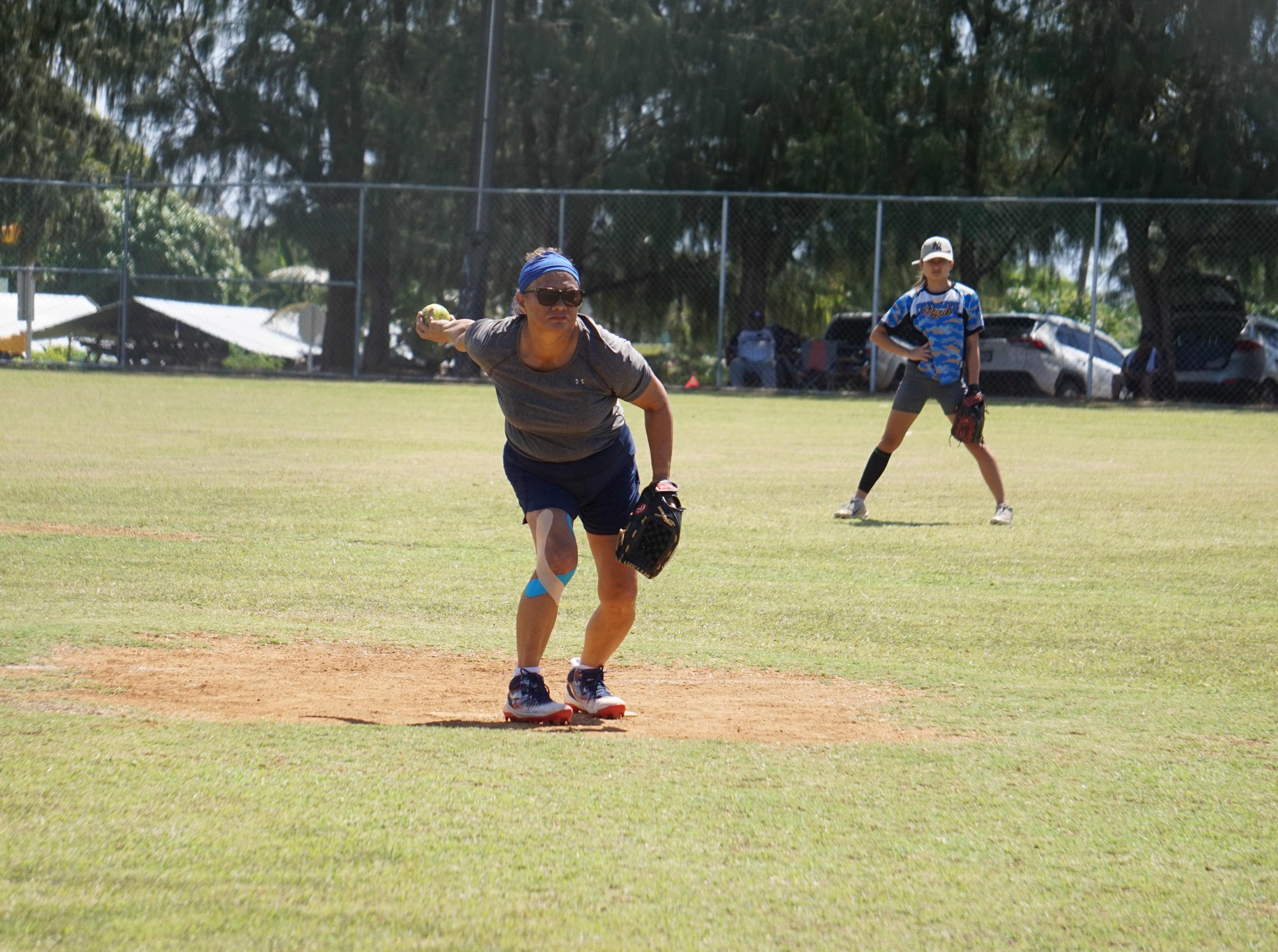The Lady Blue Jays' Bert Camacho pitches against the Lady Legals during a ladies division game of the 2023 Budweiser Belau Amateur Softball League at the Dandan baseball field on Sunday.
