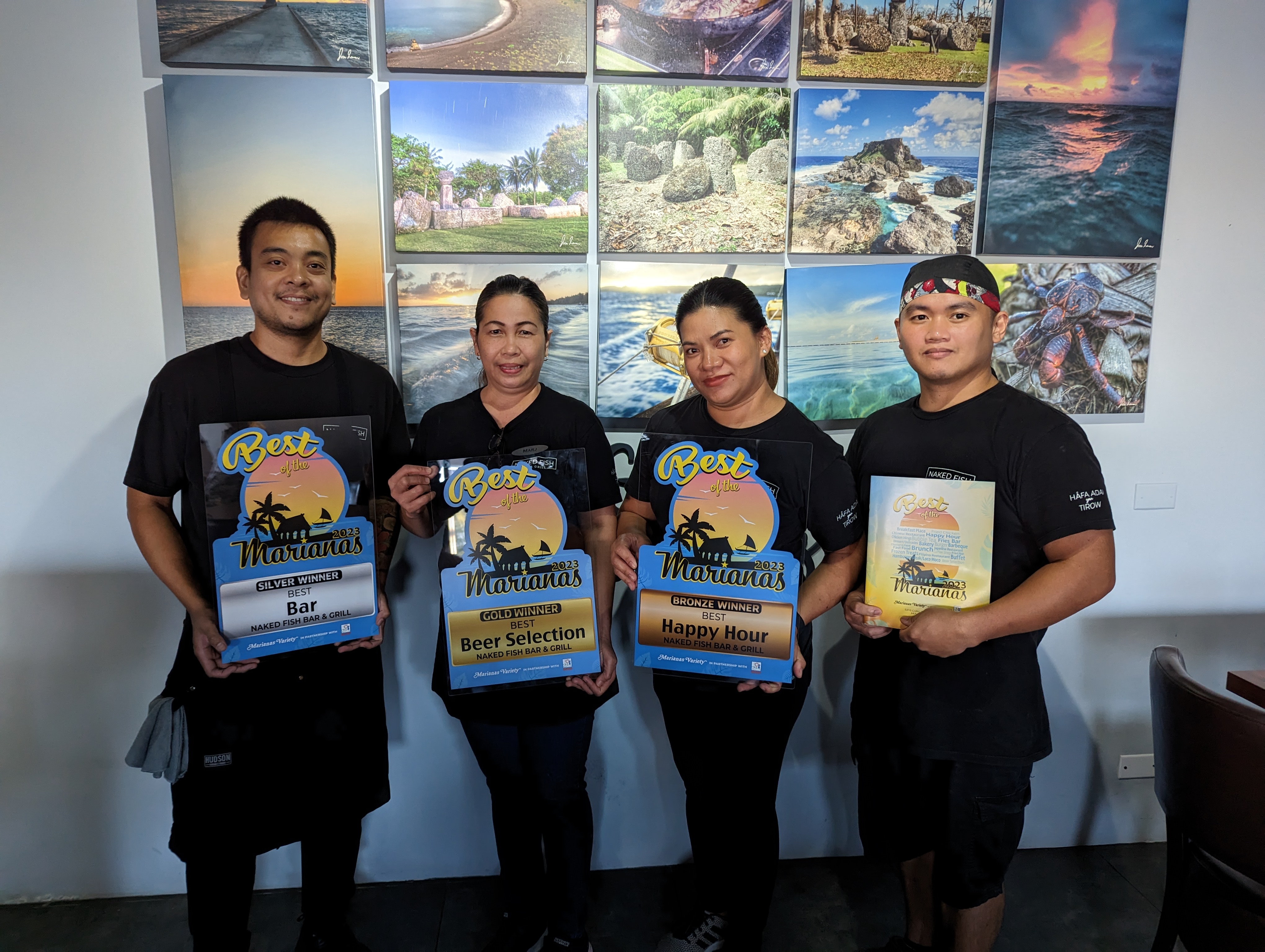 From left, Jeffrey Mendoza, Marjorie Satira, Rissa May Guerrero Viola, and Chef John Umbay of Naked Fish receive the Gold award for Best Beer Selection, Silver award for Best Bar, and Bronze award for Best Happy Hour.
