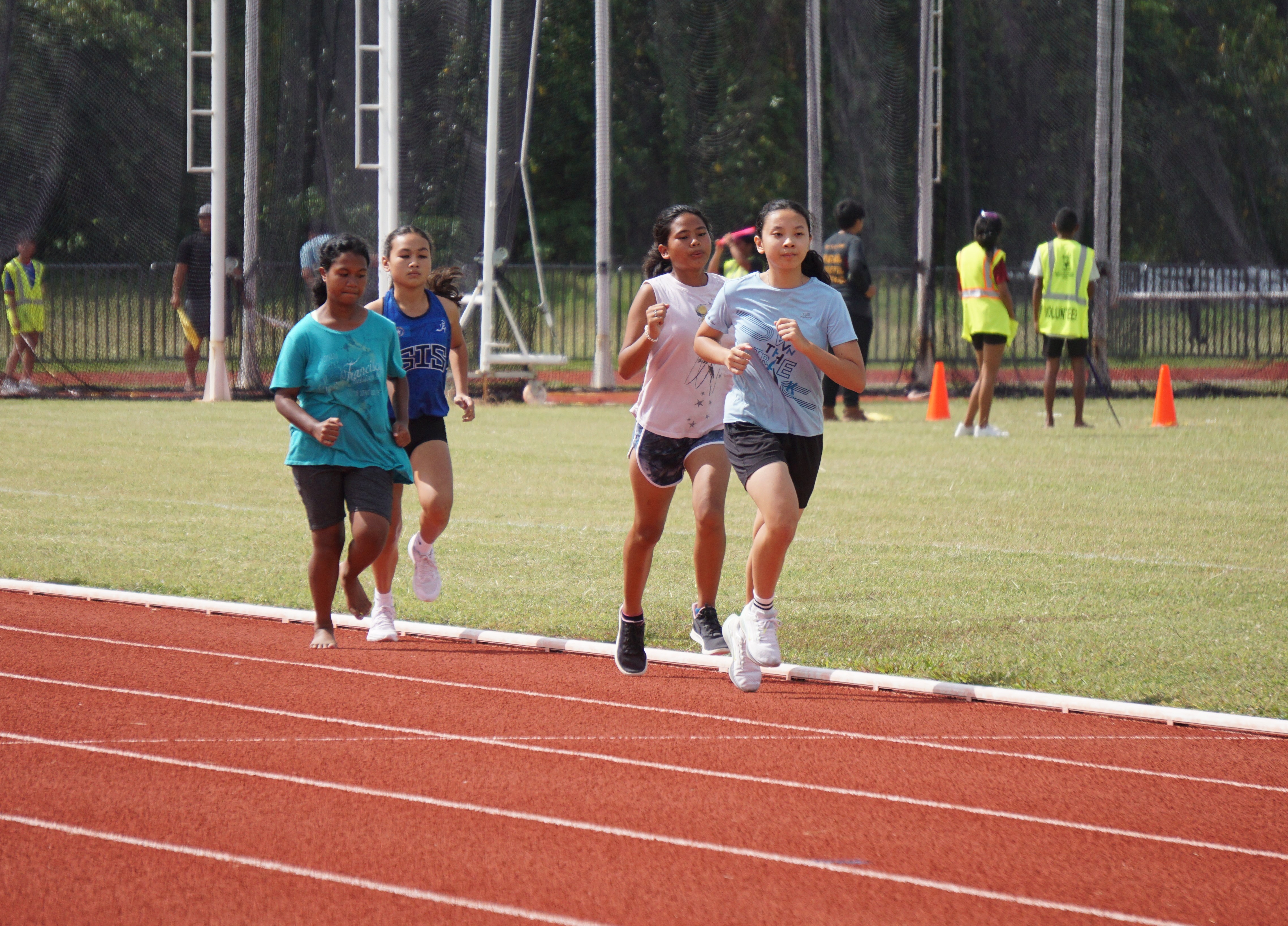 Middle school runners take off during the 400m event of the PSS-NMA All School Athletics at the Oleai Sports Complex on Saturday.