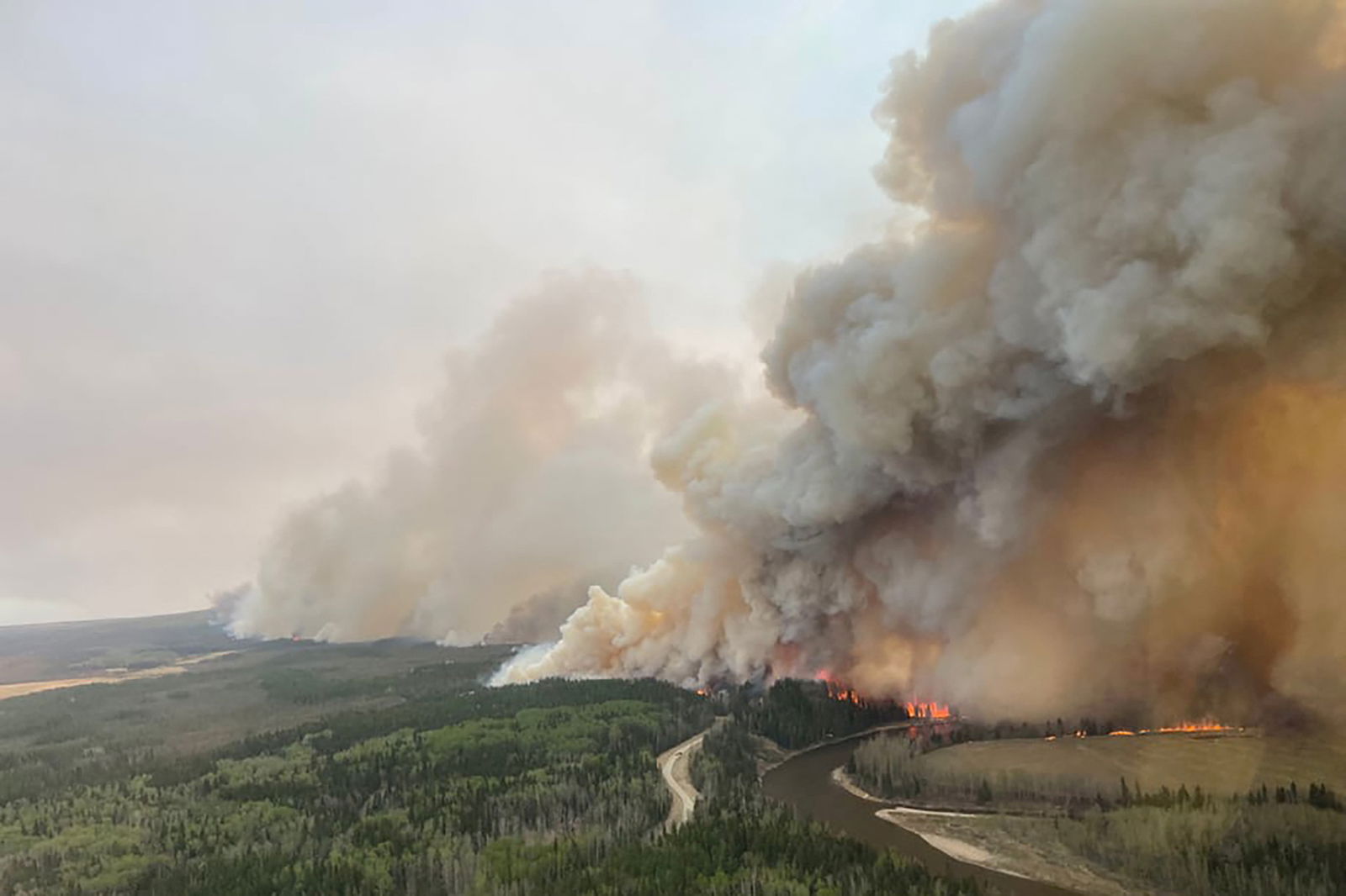 A smoke column rises from wildfire EWF-035 near Shining Bank, Alberta, Canada May 5, 2023. Alberta Wildfire/Handout via REUTERS
