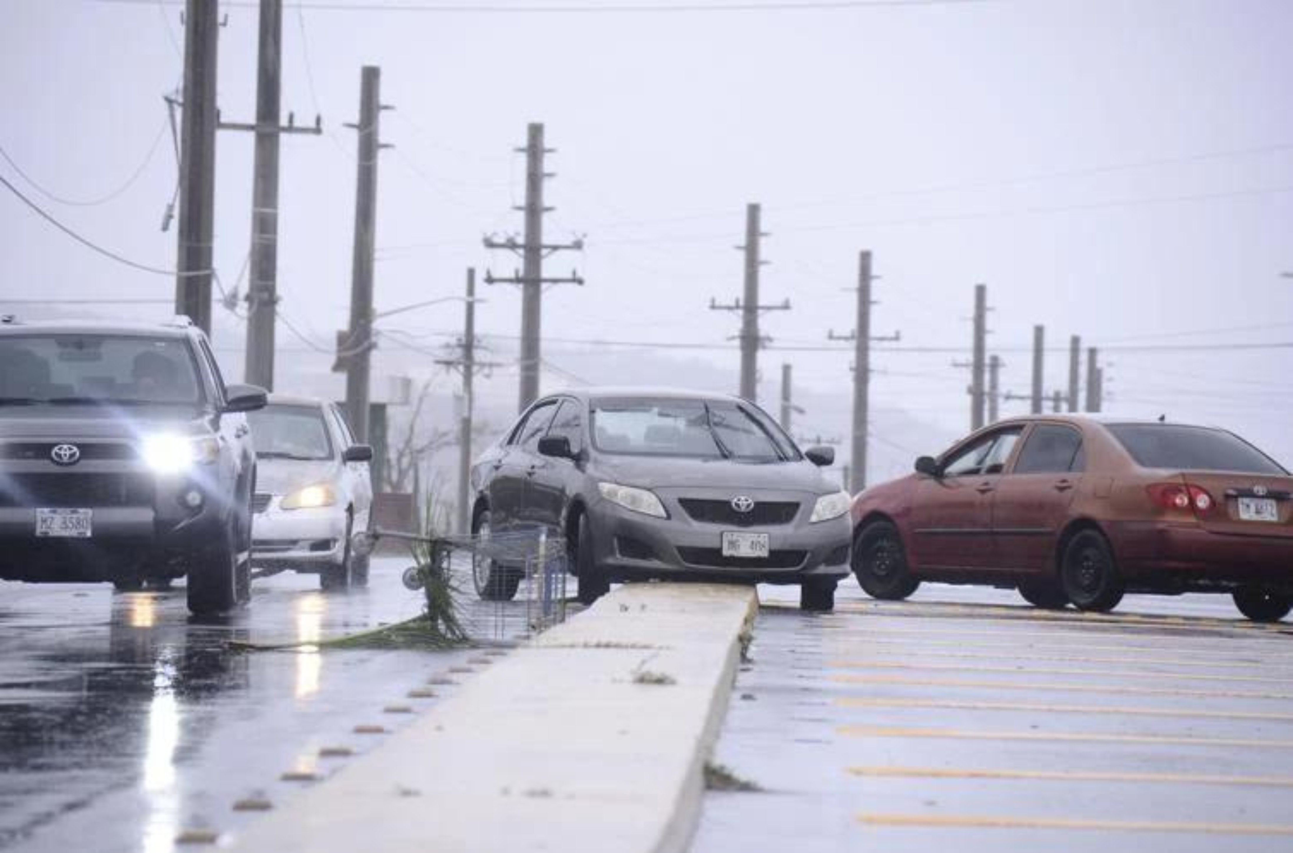 A car is left on the center media of an intersection in Mongmong-Toto-Maite Thursday morning, forcing motorist to navigate around it. It's unclear how the vehicle got there. 