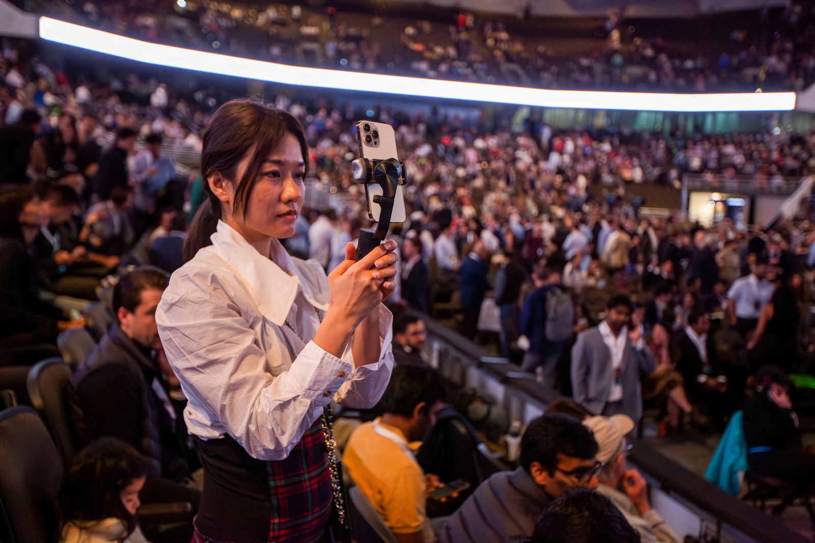 A person takes a picture as investors and guests arrive for the Berkshire Hathaway Inc annual shareholders' meeting in Omaha, Nebraska, U.S. May 6, 2023. REUTERS/Rachel Mummey