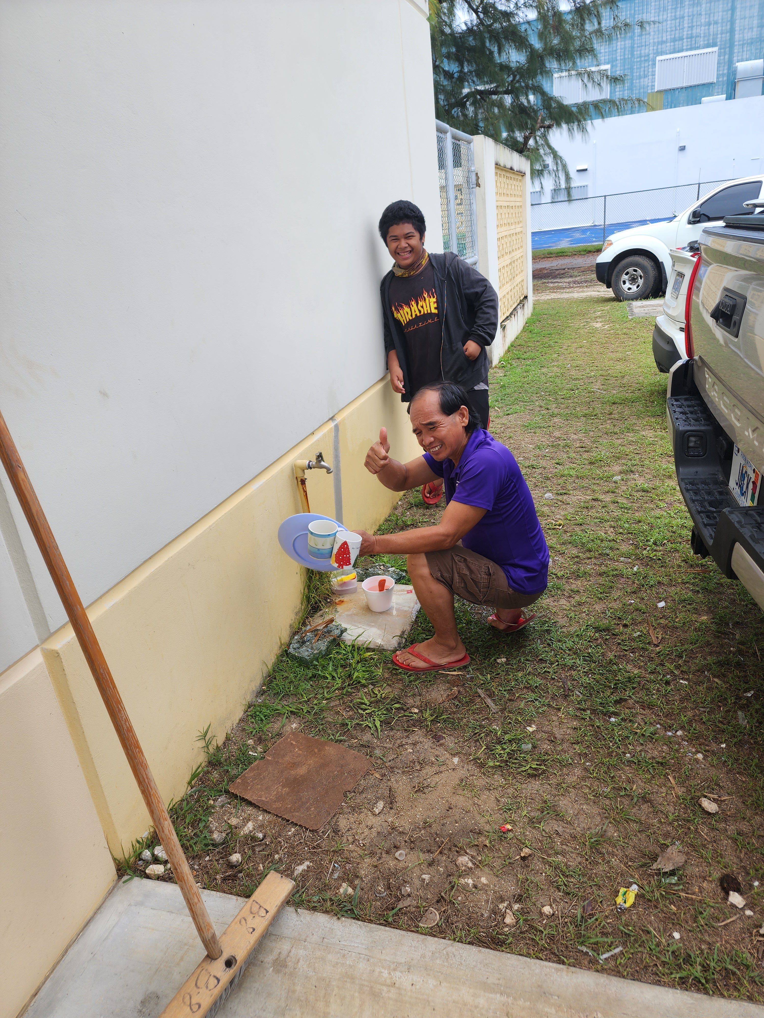 Frank Dela Cruz, foreground, was among the residents who sought shelter in the MHS cafeteria.