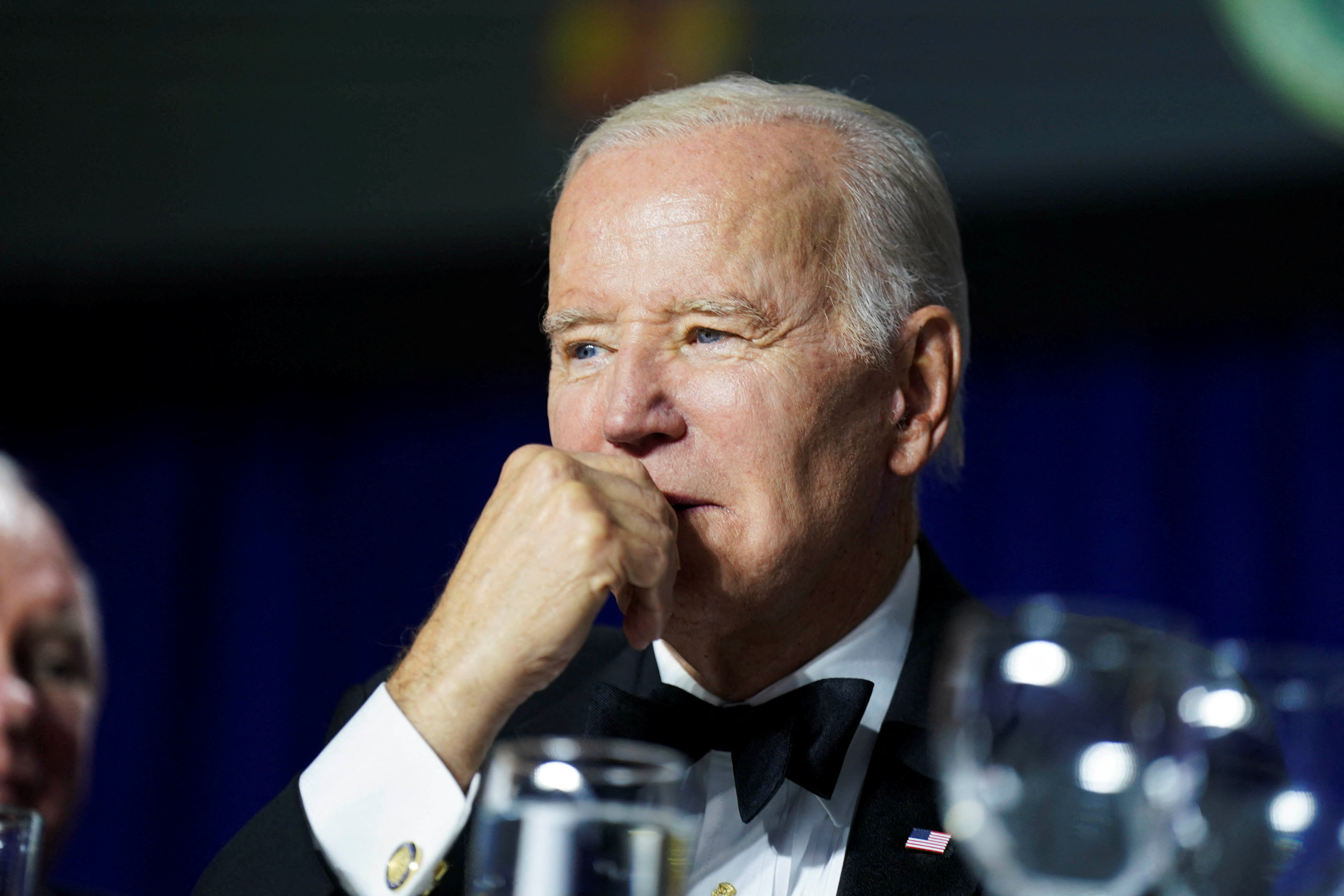 FILE PHOTO: U.S. President Joe Biden listens during the annual White House Correspondents Association Dinner in Washington, U.S., April 29, 2023. REUTERS/Al Drago