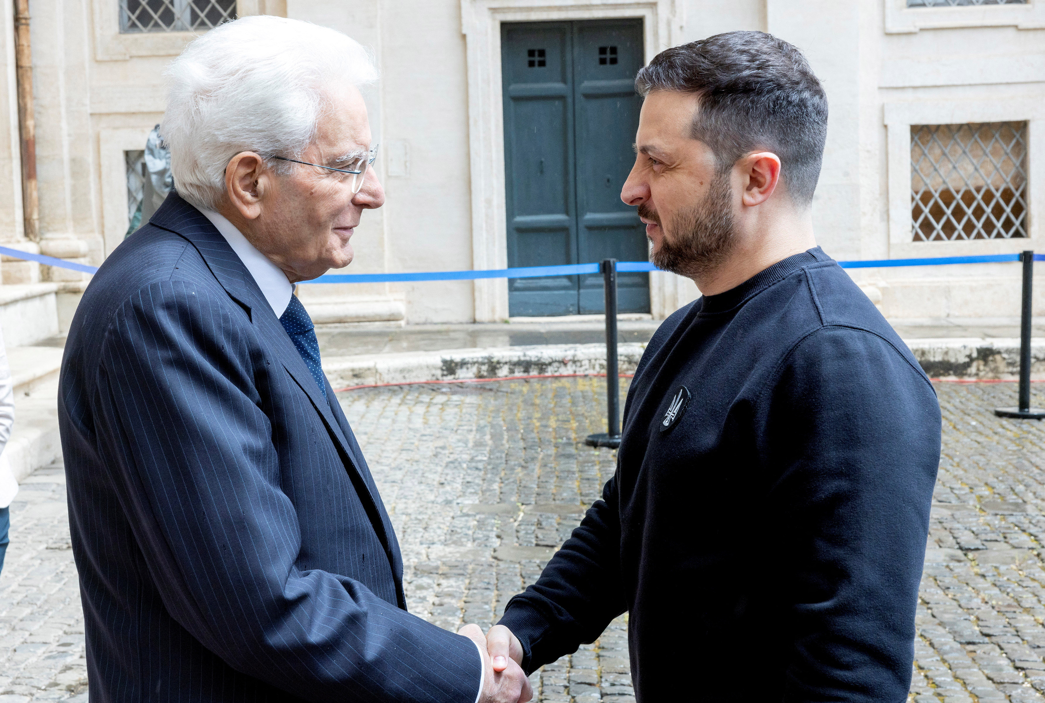 Italian President Sergio Mattarella shakes hands with Ukrainian President Volodymyr Zelenskiy in Rome, Italy May 13, 2023. Italian Presidency Press Office/Paolo Giandotti/Handout via REUTERS