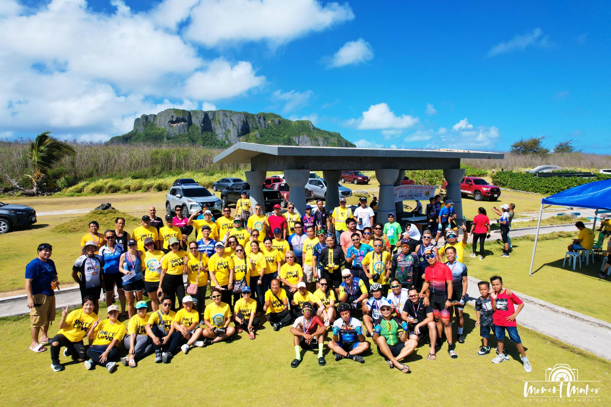 Saipan Unity Lion Club members with this year’s bike race participants at Banzai Cliff.