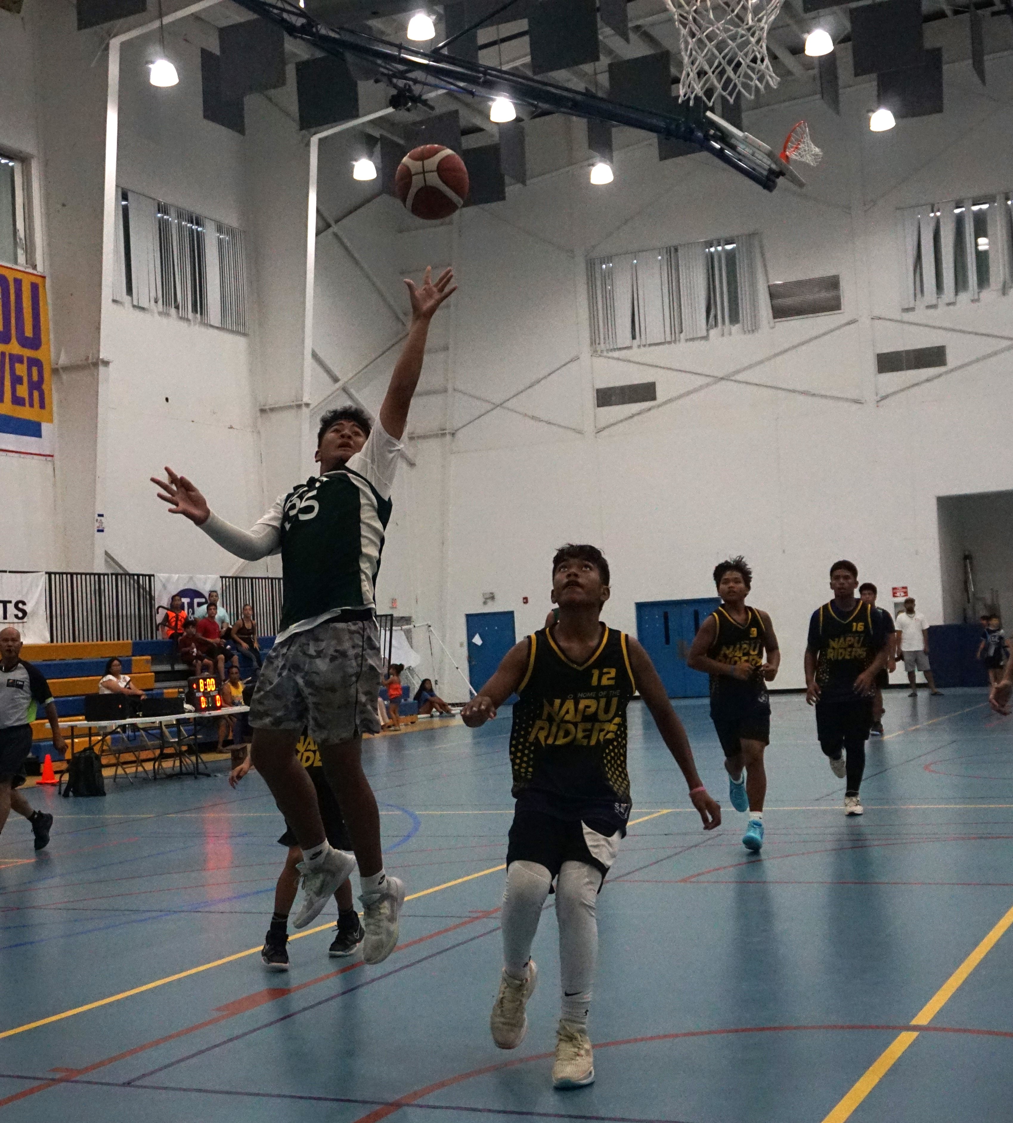 SIS' Theo Lucio extends for the off-balanced floater.